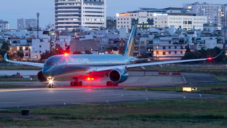 Hanoi, Vietnam: Vietnam Airlines (HVN) delivered its strongest financial performance in history in 2025, posting record annual revenue and sharply improved profitability, according to its fourth-quarter financial statements released on January 29. In the fourth quarter of 2025, the national flag carrier recorded consolidated revenue of VND 32.34 trillion (approx. US$1.3 billion), an increase of 12 percent year-on-year. Consolidated pre-tax profit reached nearly VND 540 billion during the period. Vietnam Airlines attributed the strong Q4 performance to higher seat occupancy rates and growing passenger and cargo volumes, particularly on international and regional routes. The airline also increased flight frequencies on key international services and optimized fleet utilization to meet strong demand during the year-end peak travel season. Vietnam Airlines reported consolidated revenue of more than VND 21.43 trillion for the full year 2025, marking the highest annual revenue in the company’s history and a rise of about 10 percent compared with 2024. Consolidated after-tax profit exceeded VND 7.71 trillion, with the portion attributable to the parent company reaching VND 5.51 trillion more than double that of the prior year. Beyond operational gains, Vietnam Airlines implemented multiple service upgrades aimed at boosting passenger experience and strengthening competitiveness. These included: Launch of in-flight internet services. Introduction of the carrier’s signature fragrance, “Nha”. More synchronized services at Terminal 3 of Tân Sơn Nhất International Airport. Biometric VNeID check-in capabilities. Expansion and upgrades of Lotus lounges at major airports. According to the airline, these enhancements not only elevated the travel experience but also supported business performance during the critical holiday period. Vietnam Airlines also strengthened its financial foundations in 2025 by successfully issuing 897 million new shares. This helped return both parent and consolidated equity to positive territory by the end of the year. The airline contributed VND 3.29 trillion to the State budget, a 5 percent year-on-year increase, underscoring its expanding role in supporting Vietnam’s broader economic recovery and growth. Looking ahead, Vietnam Airlines plans to build on the momentum of 2025 by enhancing operational efficiency and financial performance. For 2026, the carrier is targeting: 29.07 million passengers, a 13.2 percent increase over 2025. Approximately 13 percent growth in available seat kilometres to tap into rising demand across the Asia-Pacific aviation market. With a strengthened balance sheet and improving profitability, Vietnam Airlines said it is positioning itself for sustainable medium- and long-term growth while progressing toward its goal of becoming a five-star international airline by 2030.