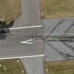 NTSB Preliminary Report Cites Unqualified Second-In-Command In Greg Biffle Plane Crash SEO DES: Just after takeoff, the jet began a left climb but the crew soon reported instrument issues. The left altimeter failed and airspeed & heading stopped SOCIAL: The NTSB released a preliminary report on the December 18, 2025 crash of a Cessna Citation 550 near Statesville, N.C., killing seven, including NASCAR champion Greg Biffle and his family. Shortly after takeoff, the crew reported instrument failures, including a faulty altimeter and loss of airspeed/heading data; Biffle was not flying. The jet struck a 29-foot approach light structure, towers, and trees while attempting a return; investigators found no structural or engine failures. North Carolina, United States: The National Transportation Safety Board (NTSB) has released a preliminary investigative report on the December 18, 2025 crash of a Cessna Citation 550 near Statesville Regional Airport, North Carolina, providing new detail into the flight’s final minutes and the sequence of technical and cockpit challenges that preceded the accident. The accident claimed the lives of seven people, including former NASCAR champion Greg Biffle, his wife Cristina, their two children, and three others. According to the NTSB’s preliminary report, the Citation departed Statesville at approximately 10:06 a.m. Eastern on a personal flight to Sarasota, Florida, under visual flight rules. The aircraft, registered to a company linked to Biffle, lifted off fully fueled with seven people aboard. Before takeoff, cockpit voice recordings captured the crew discussing a malfunctioning thrust reverser indicator light, although the thrust reversers themselves appeared operational. Just after departure, the aircraft started a left climbing turn, but soon after the crew reported a series of in-flight instrument anomalies. The left-side altimeter was reported not functioning properly, and data from the Garmin navigation system showed that airspeed and heading information stopped recording. The autopilot also disengaged about the same time, though it was unclear whether that was intentional. The NTSB confirmed that Greg Biffle was not at the controls of the aircraft when it crashed. The jet was being flown by Dennis Dutton, a retired airline pilot with multiple type ratings, seated in the left seat. His son, Jack Dutton, was in the right seat handling communications and checklists. While both men held pilot certificates, the report noted that the right-seat occupant was not qualified to serve as second-in-command (SIC) on this type of aircraft, a requirement under Federal Aviation Administration rules for that Citation model under normal operations. Neither Biffle nor Jack Dutton had the appropriate SIC endorsement, though Dutton was the pilot flying at the time of the accident. Data indicates that after reporting the instrument problems, the aircraft climbed to around 4,500 feet before the pilot briefly handed control to the right-seat occupant while troubleshooting continued. During this time, the crew attempted to activate an instrument flight rules clearance but experienced difficulty reaching air traffic control. The aircraft began a descent back toward the airport. The pilot and crew reported visually acquiring the runway environment and began configuring the plane for landing. The pilot called for flaps and landing gear extension, but landing gear indicator lights did not illuminate, suggesting electrical or indication issues. At one point on the final approach, the right-seat occupant broadcast on the airport’s common traffic advisory frequency: “We’re having some issues here.” Radar and limited flight data show the aircraft rolled out on runway heading at approximately 1,240 feet altitude and 114 knots, but both altitude and airspeed began to decay steadily as the jet continued toward the runway threshold. The plane struck a 29-foot approach light structure about 1,380 feet short of the runway, then impacted additional light towers and trees before skidding into the runway overrun area. A fire destroyed much of the fuselage. Investigators found no indication of structural failure or engine malfunction prior to impact. Both engines remained attached to the airframe, and fan blade damage was consistent with rotation at the moment of ground impact. The aircraft was not required to have a flight data recorder. Investigators recovered the cockpit voice recorder (CVR), extracting roughly 31 minutes of audio, although poor audio quality complicated parts of the review. Limited avionics data was recovered from the Garmin unit. The NTSB’s preliminary report outlines factual information about the sequence of events but does not assign probable cause. That determination, along with any contributing factors and safety recommendations, will be part of a final report, typically issued 12 to 18 months after an accident.