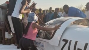 Pretoria, South Africa: A routine training flight turned fatal on Thursday evening, 19 February 2026, when a light aircraft crashed in the rural Klipgat area of Sofasonke township in the North West Province, killing both the flight instructor and the student pilot on board. The aircraft, operated by Excellentia Airline Academy, went down shortly before 6 p.m., triggering its emergency locator transmitter (ELT) and drawing an immediate response from rescue teams. Emergency responders including the Aeronautical Rescue Coordination Centre (ARCC), paramedics, police and aviation investigators reached the crash site within minutes. Despite swift efforts, both occupants were pronounced dead at the scene. Initial field reports have not confirmed a specific cause but early indications suggest that the aircraft may have experienced mechanical difficulties or sudden weather changes, but a full investigation by the South African Civil Aviation Authority (SACAA) is underway to determine the exact cause. Witnesses in the area reported hearing a loud roar in the sky around sunset, followed by smoke rising from the wreckage. The light fixed-wing trainer, a Sling 2 aircraft used for pilot instruction, was on a standard sortie when it went down with only the two pilots on board. Police later confirmed the age of the occupants as 28 and 24 respectively. In an official statement issued after the crash, Excellentia Airline Academy confirmed that one of its training aircraft was involved and that the academy was “devastated by this tragic loss.” The statement noted that it received notification from the ARCC shortly after 6 p.m., and that the SACAA had confirmed the fatalities. “Our thoughts and deepest condolences are with the families, loved ones, colleagues and fellow students affected by this tragedy,” the academy said. The academy also stated it is fully cooperating with SACAA and other authorities in the ongoing investigation, and requested that speculation regarding the cause be avoided while investigators carry out their work. It added that, “Out of respect for the families, we will not be releasing the names of those involved,” and that support services are being provided to academy staff and students. Family members and community residents gathered near the crash site on Friday, laying floral tributes and paying their respects. Relatives described both young men as passionate about aviation and committed to achieving their professional goals. A relative of the 24-year-old student said his family was “devastated and in shock,” remembering him as a diligent learner with dreams of becoming a commercial pilot. A neighbour of the instructor spoke of him as a committed mentor to younger aspiring pilots in the region. The SACAA has begun detailed investigations, gathering wreckage evidence, flight plans, witness testimony and any available electrical or onboard flight data. A preliminary report is expected to be issued within 30 days of the occurrence, as per regulatory protocol. Flight Training School Incidents in South Africa: 04 February, 2026: A Piper Cherokee 140 (ZS‑XPR) training aircraft departing from Grand Central Airport crashed near Carstenhof Hospital in Glen Austin, Midrand during a training flight. Both the flight instructor and the student pilot on board suffered serious injuries and were rushed to hospital, and the aircraft was substantially damaged. 26 October, 2025: During a morning training flight, a light aircraft suffered engine failure and attempted an emergency landing in a school field, veering into a tuckshop of Hoërskool Alberton in the City of Ekurhuleni, Gauteng. Both the instructor and student escaped unharmed. 15 October, 2025: Two training aircraft from Aviation Junction Flying School in Secunda, Mpumalanga, took off on routine flights over the KwaZulu‑Natal Midlands. Both aircraft Sling 2 types encountered poor weather with heavy mist and low visibility, lost contact with radio and radar, and later crashed in separate locations near Nottingham Road and Pietermaritzburg. The 26‑year‑old Indian trainee pilot Mayank Prajapati and 35‑year‑old South African pilot Martin Brown were killed in the twin crashes, prompting intensified calls for safety reforms in South Africa’s flight‑training sector. 13 October, 2025: A tragic training accident claimed the life of 20‑year‑old Piyush Pushp, a student from Ranchi, India, while he was undergoing solo flight training at the Vulcan Aviation Institute in Johannesburg. During the solo sortie, the light training aircraft reportedly suffered a sudden technical malfunction mid‑air, leading to a crash shortly after take‑off. 10 June, 2025: The aircraft, operated by Eagle Air Flight School, was part of a trio of light planes flying in a loose formation from an airstrip near Durban toward Pretoria. The group encountered severe weather, including low visibility and turbulence, which led them to divert from their planned refuelling stop in Ladysmith toward Greytown & crashed. Airport emergency responders arrived but all three pilots were killed.