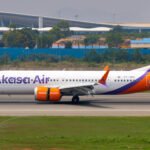 Passenger Charged For Smoking In Lavatory On Delhi-Goa Akasa Air Flight SEO DES: Passenger was found carrying a lighter, posing a potential fire risk onboard; The violation was detected during the flight & followed safety procedures SOCIAL: A passenger has been charged after allegedly smoking a beedi inside the lavatory of an Akasa Air flight from Delhi to Goa on March 7, 2026. The passenger was also found carrying a lighter, raising safety concerns. After the aircraft landed at Manohar International Airport. Police registered a case under the Bharatiya Nyaya Sanhita and the Suppression of Unlawful Acts Against Safety of Civil Aviation Act, 1982, and an investigation is underway. Image: Krish Aarush (Flickr) Video: Akasa Air Goa, India: A passenger has been charged after allegedly smoking a beedi (hand-rolled cigarette) inside the lavatory of an Akasa Air flight travelling from Delhi to Goa, raising serious safety concerns during the flight. Authorities registered a case following the aircraft’s arrival at Goa’s Manohar International Airport (Mopa), officials said. The incident occurred on March 7, 2026, on Akasa Air flight QP1625 operating from Delhi to Goa. According to police and airline officials, the passenger identified as Ashish, a resident of Delhi allegedly went to the aircraft lavatory during the flight and smoked a beedi, a hand-rolled tobacco cigarette. Airline authorities later reported that the passenger was also found carrying a lighter, which investigators said could pose a potential fire hazard inside an aircraft cabin. Officials noted that the act endangered the safety of passengers and crew members, as smoking and open flames are strictly prohibited onboard commercial flights. Crew members detected the violation during the flight and followed established safety procedures. In a statement, Akasa Air confirmed the incident, stating: “A passenger travelling on Akasa Air flight QP1625 from Delhi to Goa on March 7 was found smoking in the aircraft lavatory.” The airline said its crew adhered to all regulatory and safety protocols and handed the passenger over to authorities immediately after the aircraft landed in Goa. The carrier also confirmed it is cooperating fully with investigators. Following the complaint, Mopa Airport Police registered a case against the passenger under Section 125 of the Bharatiya Nyaya Sanhita (BNS) for acts endangering life or personal safety. Authorities also invoked Section 3(1)(C) of the Suppression of Unlawful Acts Against Safety of Civil Aviation Act, 1982, which addresses actions that threaten aviation safety. Police said the accused has been served a notice under the relevant provisions of the law, and further investigation into the incident is underway.