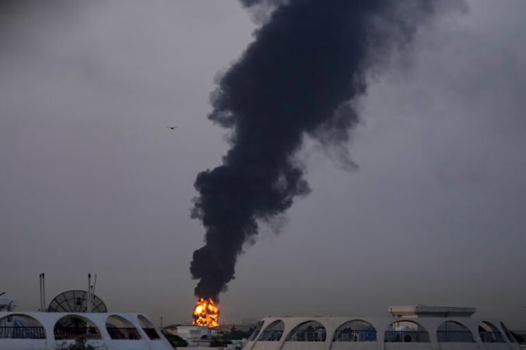 Drone Strike Near Dubai Airport Triggers Fire & Flight Suspensions Amid Gulf Crisis SEO DES: On the same day, UAE reported 6 missiles & 21 drones; Dubai airport was hit for the 3rd time in weeks with 7 deaths (5 civilians) & 145 injured since 28 Feb SOCIAL: A drone strike near Dubai International Airport on March 16 triggered a fuel tank fire, forcing temporary flight suspensions, delays, and airspace restrictions amid escalating regional conflict. The attack, part of a broader wave of drone and missile strikes targeting the UAE, caused widespread disruption with dozens of flights cancelled, diverted, or delayed, impacting major global and regional airlines. Authorities quickly contained the fire, enforced safety measures, and gradually resumed operations after clearance, with no casualties reported. Dubai, United Arab Emirates: An Iranian drone strike near Dubai International Airport triggered a major fuel tank fire on March 16, forcing a temporary suspension of flight operations and disrupting global air traffic, as tensions in the Middle East escalated sharply. According to multiple reports, the attack occurred early Monday (March 16) when a drone struck a fuel storage tank in the airport vicinity, sending thick plumes of smoke into the air and prompting immediate emergency response. Firefighters contained the blaze within hours, and no casualties were reported at the airport site. Airport operations were halted for several hours, with gradual resumption later the same day. Airspace closure lasted approximately 2 hours, affecting multiple inbound and outbound flights. Dozens of flights were cancelled, diverted, or returned mid-route. The incident is part of a wider wave of Iranian drone and missile attacks targeting the United Arab Emirates amid the ongoing Iran–US–Israel conflict, which began on February 28, 2026. On the same day, the UAE reported multiple incoming threats, including 6 ballistic missiles and 21 drones. The Dubai airport strike marked the third such incident targeting the airport in recent weeks, highlighting increasing risks to civilian aviation infrastructure. Since the start of the conflict, seven people including five civilians have been killed in the UAE and 145 have been injured, according to official figures from the Defense Ministry. Iran has sent 304 ballistic missiles, 15 cruise missiles and 1,627 drones to the UAE since Feb. 28, the Defense Ministry said in an update Monday. Additional drone-related fires were reported in Umm Al Quwain and Fujairah, indicating coordinated regional targeting. The attacks are widely seen as retaliation within the broader regional conflict, with Iran warning that strategic infrastructure in Gulf countries could be targeted. Authorities responded swiftly by halting flight operations and restricting airspace: Dubai airport suspended flights for several hours after the strike. The UAE temporarily closed its airspace for safety, leading to wider regional disruption. Foreign airline operations were suspended as a precautionary measure. Several flights were diverted to Al Maktoum International Airport and other regional hubs. In one notable case, an Emirates flight from Edinburgh was forced to turn back mid-air after nearly nine hours of flying, illustrating the scale of disruption. The disruption impacted several Indian airlines such as Air India, Air India Express, IndiGo, and SpiceJet suspended Dubai operations due to restrictions. Emirates temporarily halted operations before gradually resuming services after safety clearance. Etihad Airways and others adjusted schedules amid airspace uncertainty. Late on Monday, Dubai’s aviation regulator suspended landing permissions for foreign airlines at Dubai airports until further notice due to escalating regional tensions. British Airways suspended Dubai flights until at least June. Other major carriers including Air France, Lufthansa, and Virgin Atlantic also paused or rerouted services. Authorities implemented multiple safety and contingency measures, Dubai Civil Defence extinguished the fire and initiated cooling operations. Aviation authorities suspended landing permissions and advised passengers to avoid travel unless necessary. Roads near the airport were temporarily closed and later reopened. Flights resumed after safety assessments and clearance from authorities, with operations returning gradually to normal.