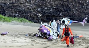Helicopter Crash On Nā Pali Coast; All 5 Onboard Survive, Cause Under Investigation SEO DES: Owned by Jack Harter the helicopter crash left all five alive with one passenger suffering a back injury while the others and the pilot were unhurt SOCIAL: A helicopter owned by Jack Harter Helicopters crash-landed at Kalalau Beach along the Nā Pali Coast, United States, with all five onboard surviving. One passenger sustained a back injury, while others were unharmed and later evacuated by another Jack Harter helicopter. The aircraft landed on the beach, suggesting a possible controlled landing, though the cause remains unconfirmed. Rescue teams from the Kauai Fire Department responded to the remote site, where access is limited. Authorities have launched an investigation into the incident. Nā Pali Coast, United States: A helicopter carrying five people crash-landed along the remote Nā Pali Coast of Kauai, Hawaii, on Thursday afternoon, triggering a complex rescue operation in one of the region’s most inaccessible areas. According to authorities, the aircraft went down at Kalalau Beach, a secluded stretch along the island’s north shore that is accessible only by air, sea, or a challenging hiking trail. According to the Kauai Fire Department report, the helicopter was owned by Jack Harter, a tour provider in business for sixty years. The helicopter was carrying one pilot and four passengers at the time of the incident. Emergency officials confirmed that all five people onboard survived with one of the four passengers suffering a back injury. The three other passengers and the pilot did not report any injuries. They were subsequently picked up by another Jack Harter helicopter. Preliminary information indicates the helicopter came down on the beach rather than in the ocean, suggesting a possible controlled or forced landing. However, officials have not confirmed the exact sequence of events leading to the crash. The Kauai Fire Department led the emergency response, deploying rescue teams to the scene to provide immediate medical assistance and coordinate the evacuation of the injured from the isolated location. The difficult terrain and limited access significantly complicated response efforts. No distress call, mechanical failure, or weather-related cause has been confirmed at this stage. An investigation into the incident is underway, with federal aviation authorities expected to be involved. Investigators are likely to examine weather conditions, aircraft maintenance records, and pilot actions to determine the cause of the crash. The Nā Pali Coast is a popular destination for helicopter tours due to its dramatic cliffs and lack of road access. However, the region is also known for rapidly changing weather, strong winds, and turbulence, which can pose operational challenges.