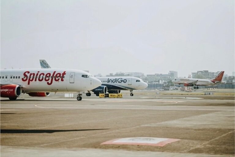 Govt Removes Fare Caps As Airlines Oppose 60% Seats Free Of Selection Charges SEO DES: Authorities want fair fares, but airlines warn lost add-on revenue may push base prices up, raising concerns over pricing freedom and financial strain SOCIAL: The government’s move to mandate 60% free seat selection and scrap fare caps has drawn strong opposition from airlines, which warn it could lead to higher ticket prices. While authorities have asked carriers to keep fares reasonable and transparent, airlines argue the loss of ancillary revenue may force them to raise base fares, raising concerns over pricing freedom, financial strain, and market impact. The earlier fare caps, which set limits based on distance, have now been withdrawn from March 23, 2026, restoring pricing flexibility to airlines. However, the move signals a shift toward self-regulation, with the government expecting airlines to balance affordability with market-driven pricing. New Delhi, India: A policy push by the government to strengthen passenger rights and enforce fare transparency has triggered sharp resistance from India’s leading airlines, setting the stage for a broader debate over pricing freedom and regulatory oversight in the aviation sector. The Ministry of Civil Aviation, through the Directorate General of Civil Aviation (DGCA), has directed carriers to ensure that at least 60% of seats on every flight are available for free selection, a move aimed at reducing ancillary charges and allowing passengers, particularly families booked under a single PNR, to be seated together without paying extra. The directive comes alongside a broader advisory asking airlines to maintain fares that are “reasonable, transparent and commensurate with market conditions,” even as the government transitions away from direct fare controls. Major carriers including Air India, IndiGo and SpiceJet have opposed the 60% free seat selection mandate, arguing that it interferes with their commercial pricing models and could have unintended financial consequences. Represented by the Federation of Indian Airlines (FIA), these carriers have formally approached the government, stating that seat selection fees form a critical component of ancillary revenues in an industry already operating on thin margins. Airlines contend that such non-ticket income helps offset high operating costs, including fuel, maintenance, and airport charges, and that restricting it would disrupt their financial balance. The government’s latest stance also marks a significant shift in its fare regulation approach. In its December 6 order, the ministry had imposed fare caps on economy class tickets, limiting prices to ₹7,500 for routes up to 500 km, ₹12,000 for distances between 500 and 1,000 km, ₹15,000 for sectors ranging from 1,000 to 1,500 km, and ₹18,000 for routes beyond 1,500 km, excluding taxes and additional fees. However, with operations now stabilised, the ministry has announced that these caps “shall stand withdrawn with effect from March 23, 2026,” effectively restoring pricing flexibility to airlines while simultaneously cautioning them against excessive or opaque fare structures. Airlines have warned that the combination of removing ancillary revenue streams through mandatory free seat allocation and expecting fare restraint could create financial strain. Industry executives argue that instead of lowering travel costs, the policy may inadvertently push up base fares as carriers attempt to recover lost income. This, they say, could neutralise the intended benefit for passengers and lead to a redistribution of costs rather than an actual reduction in overall ticket prices. The industry has also raised concerns about regulatory overreach, maintaining that fare determination in a competitive market should remain dynamic and driven by demand-supply factors. The market response has reflected these concerns, with airline stocks reacting negatively following the announcement, highlighting investor apprehension over potential revenue impacts. The ancillary revenues, including seat selection, baggage fees, and onboard services, have become an increasingly important part of airline business models globally, and any disruption to this stream could have wider financial implications. For passengers, the new framework promises immediate relief in terms of fewer add-on charges and improved seating convenience, particularly for families and groups. At the same time, the removal of fare caps theoretically allows for more competitive pricing, but also raises the risk of price volatility if not closely monitored. The government’s approach indicates a shift toward a hybrid model, where airlines are given pricing freedom but are expected to exercise self-regulation under regulatory scrutiny.