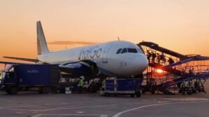 IndiGo Tops India In Pilot Numbers But Has Lowest Pilot-To-Aircraft Ratio At 7.6 SEO DES: SpiceJet has the highest pilots per aircraft, followed by Akasa Air, Air India and Air India Express, while IndiGo ranks lowest among major Indian airlines SOCIAL: The government said IndiGo has the lowest pilot-to-aircraft ratio among Indian airlines at 7.6, meaning about eight pilots per aircraft. Other airlines have higher ratios: SpiceJet (9.4), Akasa Air (9.33), Air India (9.1), and Air India Express (8.8). IndiGo employs about 5,200 pilots, including 970 women, the highest among domestic carriers. Other airlines employ 3,123 pilots at Air India, 1,820 at Air India Express, 761 at Akasa Air, and 375 at SpiceJet. The disclosure comes after IndiGo CEO Pieter Elbers resigned on March 10 following flight disruptions in December 2025 that affected about 3 lakh passengers. The DGCA fined the airline ₹22.20 crore over operational lapses. New Delhi, India: India’s largest airline IndiGo has the lowest pilot-to-aircraft ratio among domestic carriers, the government informed Parliament, highlighting staffing disparities across the country’s aviation sector. The data also reveals six major domestic airlines in India together employ 13,989 pilots. Responding to a question in the Lok Sabha, Minister of State for Civil Aviation Murlidhar Mohol said IndiGo has a pilot-to-aircraft ratio of 7.6, meaning the airline deploys about eight pilots per aircraft on average. Airlines typically assign several pilots to each aircraft because planes operate multiple flights daily and pilots must observe mandatory rest periods under aviation safety regulations. Government data presented to Parliament shows that other Indian carriers maintain higher pilot-to-aircraft ratios than IndiGo: SpiceJet: 9.4 pilots per aircraft Akasa Air: 9.33 pilots per aircraft Air India: 9.1 pilots per aircraft Air India Express: 8.8 pilots per aircraft IndiGo: 7.6 pilots per aircraft The figures place IndiGo at the bottom among India’s major scheduled airlines in terms of pilot availability relative to fleet size. The government also disclosed the total number of pilots employed by major Indian carriers. IndiGo currently employs around 5,200 pilots, including 970 women pilots, the highest number among domestic airlines. Pilot employment across other airlines is as follows: Air India: 3,123 pilots, including 508 women Air India Express: 1,820 pilots, including 234 women Akasa Air: 761 pilots, including 76 women SpiceJet: 375 pilots, including 58 women The data also revealed that Air India Express employs the highest number of foreign (expatriate) pilots at 48, while IndiGo has hired 29 expatriate pilots. The parliamentary disclosure comes days after Pieter Elbers, Chief Executive Officer of IndiGo, resigned on March 10. The leadership change follows a major operational disruption in December 2025, when the airline experienced widespread flight cancellations and delays that affected around 300,000 passengers. Following the incident, India’s aviation regulator Directorate General of Civil Aviation (DGCA) imposed a ₹22.20-crore penalty on the airline for operational lapses. This triggered broader scrutiny of workforce planning and operational preparedness at the country’s largest airline as it continues to expand its fleet and network. India’s aviation sector has been expanding rapidly, with airlines adding aircraft and routes to meet rising passenger demand. The government’s data reflects how pilot availability relative to fleet size varies widely among airlines, a factor that can influence scheduling flexibility and operational resilience.