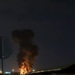 Drone Strike Triggers Fire At Kuwait International Airport Amid Escalating Gulf Crisis SEO DES: Kuwait has reported multiple recent attacks, including strikes on radar systems & fuel tanks, reflecting rising threats to critical aviation infrastructure SOCIAL: A drone strike hit a fuel tank at Kuwait International Airport in Kuwait City, Kuwait, triggering a fire that was quickly contained with no casualties and limited damage. The incident is part of a series of recent drone and missile attacks linked to escalating Iran-U.S.-Israel tensions, with authorities continuing investigations as regional security risks intensify. Kuwait has reported multiple similar attacks in recent weeks, including strikes on radar systems and fuel facilities, reflecting growing threats to critical aviation infrastructure. The situation reflects a broader regional escalation, with Gulf nations facing increased aerial threats and rising concerns over aviation safety and fuel supply stability. Kuwait City, Kuwait: A drone strike targeting fuel storage infrastructure at Kuwait International Airport triggered a fire on Wednesday, marking the latest escalation in a widening regional conflict linked to the ongoing Iran-U.S.-Israel tensions. According to Kuwait’s Civil Aviation Authority, the attack struck a fuel tank at the airport, causing a blaze that was swiftly contained by emergency response teams. Authorities confirmed that no casualties or injuries were reported, and initial assessments indicated that the damage was limited to infrastructure. Emergency protocols were immediately activated, with firefighting units responding to the scene and bringing the situation under control within a short period. Officials have not yet disclosed the origin of the drone or the group responsible, and investigations remain ongoing. Agency spokesman Abdullah Al-Rajhi said the impact was “limited,” confirming that firefighters were continuing operations to fully extinguish the blaze. Preliminary assessments indicated that the attack caused only material damage. The incident is not isolated. Kuwait has faced repeated drone and missile attacks in recent weeks, as regional tensions intensified following coordinated military actions involving Iran, the United States, and Israel. Wednesday’s strike is the latest in a string of attacks targeting Kuwait’s main airport since the conflict intensified on February 28. Earlier incidents include a March 14 drone strike on radar systems and a March 8 attack that damaged fuel storage facilities. A separate strike on a passenger terminal had left several people with minor injuries. Kuwait’s military has repeatedly reported “waves of hostile drones” entering its airspace, with air defense systems actively intercepting incoming threats. The attack comes amid a broader escalation in the Middle East, where Iran has launched drone and missile strikes targeting the U.S.-linked assets and allied countries across the Gulf, including Kuwait, Bahrain, and Jordan. Kuwait, which hosts U.S. military installations, has increasingly found itself exposed to retaliatory strikes as the conflict expands beyond its initial theaters. In recent weeks, the country has also reported casualties among security personnel and damage to infrastructure linked to ongoing aerial attacks, reflecting the persistent threat environment. Globally, the conflict has begun to impact aviation operations and fuel supply chains, with rising jet fuel prices and early signs of disruptions to flight networks in parts of Asia and beyond. Kuwaiti authorities continue to assess the full extent of the damage and are working to determine the source and intent behind the attack. No group has officially claimed responsibility so far.