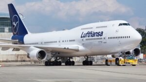 Lufthansa Pilots Plan 48-Hour Strike From March 12, Flights Across Germany Disrupted SEO DES: The union is demanding higher contributions to Lufthansa’s pension plan, saying inflation & cost-cutting have reduced pilots’ long-term retirement benefits SOCIAL: Pilots at Lufthansa have announced a 48-hour strike from March 12 to March 13, called by the pilots’ union Vereinigung Cockpit, amid a dispute over pensions, working conditions, and restructuring within the airline group. The walkout could involve over 5,000 pilots and affect passenger and cargo operations, including Lufthansa Cargo and regional carrier Lufthansa CityLine. The strike followed a February 12, 2026 nationwide walkout that forced the airline to cancel around 800 flights, disrupting travel for about 100,000 passengers. Frankfurt, Germany: Pilots at Germany’s flagship carrier Lufthansa pilots have announced a 48-hour strike beginning March 12, escalating a long-running labor dispute between the airline and pilot representatives over pensions, employment conditions and corporate restructuring. The industrial action was called by the German pilots’ union Vereinigung Cockpit (VC). According to the union, the strike will begin at 00:01 local time on March 12 and continue until 23:59 on March 13, affecting both passenger and cargo flights operated by Lufthansa departing from German airports. The union has called on more than 5,000 Lufthansa pilots to join the walkout. The strike is expected to impact pilots working for Lufthansa’s mainline operations as well as Lufthansa Cargo and potentially pilots from its regional subsidiary Lufthansa CityLine, which operates feeder flights to major hubs such as Frankfurt and Munich. VC President Andreas Pinheiro said the union wanted to avoid escalating tensions but accused Lufthansa of failing to present a concrete proposal. “It doesn’t help if the other side only signals a willingness to talk but doesn’t want to discuss substantial improvements to the company pension scheme,” said Pinheiro. Arne Karstens, spokesperson for the union’s collective bargaining committee, said seven rounds of negotiations and mediation attempts had failed, and that talks would not resume until Lufthansa presents a “negotiable offer.” The dispute centers largely on retirement and financial security for pilots. The VC union is demanding higher employer contributions to Lufthansa’s corporate pension plan, arguing that inflation and the airline’s cost-cutting measures have reduced the long-term value of pilots’ retirement benefits. Union officials also say ongoing restructuring within the Lufthansa Group and uncertainty surrounding the future of subsidiaries such as Lufthansa CityLine have intensified concerns about job security and working conditions. Negotiations between Lufthansa management and union representatives have so far failed to reach an agreement, prompting the union to escalate the dispute through a strike. The planned March strike follows another major labor action earlier this year. On February 12, 2026, pilots and cabin crew staged a 24-hour nationwide strike, forcing Lufthansa to cancel hundreds of flights across Germany and disrupting travel for tens of thousands of passengers. Reports indicated that around 800 flights were cancelled, affecting approximately 100,000 passengers, with major disruptions concentrated at the airline’s primary hubs in Frankfurt and Munich. The February strike was driven by similar issues, including disagreements over pensions and broader labor negotiations between airline management and employee unions. The two-day strike in March again might disrupt Lufthansa’s flight operations across Germany, potentially leading to large-scale flight cancellations and delays for both passenger and cargo services. Airlines typically attempt to mitigate such disruptions by rebooking travelers onto alternative flights, including those operated by partner carriers within the Star Alliance network. VC said several routes would be exempt from the strike due to geopolitical tensions and humanitarian considerations. Flights to Egypt, Azerbaijan, Bahrain, Iraq, Israel, Yemen, Jordan, Qatar, Kuwait, Lebanon, Oman, Saudi Arabia and the United Arab Emirates will continue to operate. Lufthansa has previously criticized strike actions as unnecessary escalation, arguing that financial constraints limit its ability to meet union demands while maintaining competitiveness in Europe’s airline market.