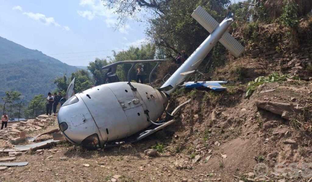 Nepal Helicopter Crash In Khotang During Landing, One Passenger Critically Injured SEO DES: The helicopter operated by Air Dynasty Heli Service carried five passengers and the body of a deceased individual for final rites when the incident occurred SOCIAL: A helicopter operated by Air Dynasty Heli Service crashed while landing in Balabesi, Khotang district of eastern Nepal, leaving one passenger injured while all others, including the pilot, were safe. The aircraft had departed from Kathmandu carrying five passengers and the body of a deceased person when it lost balance during touchdown on farmland around 11:51 a.m. local time and overturned. It sustained damage after rolling sideways on landing. Authorities confirmed no fatalities. The injured elderly passenger suffered leg and eye injuries and was airlifted to Kathmandu for treatment. Emergency responders and another helicopter from the same operator carried out rescue operations quickly. Preliminary reports suggest strong winds, dust reducing visibility, and loss of control during landing may have contributed, though the Civil Aviation Authority of Nepal has launched an investigation. Khotang, Nepal: A helicopter operated by Air Dynasty Heli Service Pvt. Ltd. crashed while attempting to land in Balabesi area of Khotang district in eastern Nepal on Wednesday, leaving one passenger critically injured while all other occupants survived with minor injuries, according to civil aviation officials and local authorities. The helicopter operated by pilot Sabin Thapa, had departed from Kathmandu, was carrying five passengers along with the body of a deceased individual being transported for final rites. The aircraft was attempting a landing on farmland in Balabesi around 11:51 a.m. local time when it suddenly lost balance and overturned upon touchdown. Officials confirmed that the helicopter hit the ground during its final approach and rolled sideways before coming to rest, sustaining significant damage. “No human casualties have been recorded. More details are due”, Rekha Kandel, chief district officer of Khotang district told ANI. The critically injured passenger, identified in local reports as an elderly man, 65, a resident of Lalitpur named Kaji Bahadur, suffered injuries to his leg and eye and was immediately airlifted to Kathmandu for advanced medical treatment using another helicopter dispatched from the same operator. The helicopter was carrying the lifeless body of Manalakshmi Rai, 77, a resident of Balabensi who passed away a month ago in the UK. The body as reported was being brought by her relatives for cremation. Also on board the helicopter were the deceased’s husband, Dakmani Rai, 83, son Balkumar Rai, 53, daughter Laxmi Rai, 47 and 40-year-old Samala Rai. Officials confirmed that all passengers along with the pilot Sabin Thapa were safely rescued from the crash site. Preliminary assessments suggest the crash may have been triggered by: Strong winds at the landing site Dust clouds reducing visibility during touchdown Loss of control during final landing phase Authorities have not confirmed the final cause, and a formal investigation has been launched by Nepal’s aviation regulator. Footage circulating online shows the helicopter descending normally before suddenly tipping on its side during landing. The aircraft then overturned on the uneven terrain, with locals rushing immediately to rescue passengers. Local residents, along with emergency responders, quickly reached the site and helped evacuate all occupants. Another Air Dynasty helicopter was deployed to transport the injured passenger and pilot to Kathmandu for treatment. Officials confirmed that emergency response operations were completed within a short time after the incident. The helicopter involved belongs to Air Dynasty Heli Service Pvt. Ltd., one of Nepal’s private helicopter operators frequently used for medical, rescue, and charter flights in mountainous regions. "One passenger on board the helicopter has been injured. The pilot and other passengers are safe. Another helicopter with registration number 9N-ANA has also been dispatched for the rescue of the injured passenger," the helicopter company announced in a statement. Helicopter operations, especially in eastern hill districts like Khotang, are often exposed to sudden wind shifts and dust conditions during landing.
