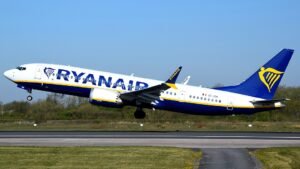 Ryanair Flight Aborts Route After Mid-Air Emergency, Returns To Manchester SEO DES: The crew declared an emergency and made a U-turn over the North Sea, with the cause unconfirmed; No injuries were reported among passengers or crew SOCIAL: A Ryanair Boeing 737-800 flight from Manchester to Sandefjord declared a mid-air emergency and returned after a precautionary turnaround over the North Sea on March 24, 2026. The crew issued a 7700 emergency squawk while at cruising altitude, prompting priority handling before safely landing back in Manchester. No injuries were reported, and the exact cause remains unconfirmed, though the return is believed to be precautionary. Manchester, United Kingdom: A Ryanair flight departing Manchester for Sandefjord, Norway, declared a mid-air emergency and returned to its origin airport after executing a precautionary turnaround over the North Sea on March 24, 2026. The aircraft, a Boeing 737-800 operated by Ryanair, had reached cruising altitude when the crew issued a general emergency squawk (7700), prompting immediate attention from air traffic control and emergency response protocols. According to multiple reports, the flight had progressed only partway along its route when the pilots identified an issue requiring urgent action. The crew then declared an emergency and initiated a controlled U-turn while flying over the North Sea. A 7700 squawk, universally recognised in aviation as a signal of general emergency, ensured the aircraft received priority handling from air traffic controllers and cleared airspace for a direct return. The aircraft safely landed back at Manchester Airport, where emergency services were placed on standby as a precaution. No injuries were reported among passengers or crew. Authorities and the airline have not confirmed the exact cause of the emergency. However, such declarations are often linked to technical warnings, onboard medical situations, or precautionary system alerts. Ryanair has not released a detailed statement specifying the nature of the issue. Early indications suggest the decision to return was precautionary, consistent with standard aviation safety protocols prioritising risk mitigation.