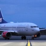 Small Training Aircraft Makes Emergency Landing In Hudson River, 2 Onboard Survive SEO DES: The aircraft, registered To American Airman Inc. was heavily damaged Both occupants were rescued by Coast Guard, Air Guard & police; FAA investigates SOCIAL: A small Cessna 172 training aircraft made a forced emergency landing on the icy Hudson River near the Newburgh–Beacon Bridge on the evening of March 2, 2026. The plane, which departed from Long Island MacArthur Airport, experienced in-flight difficulties and descended into the river around 7:55 p.m.. Both pilot and passenger survived with minor injuries. The aircraft, registered to American Airman Inc., sustained significant damage. A coordinated rescue involved the U.S. Coast Guard, Air National Guard, police, and fire departments. Authorities, including the FAA, are investigating the cause of the emergency landing. Officials praised first responders and likened the rescue to the 2009 “Miracle on the Hudson.” The flight had been following the Hudson River corridor, a common route for small aircraft, near Stewart International Airport, about 60 miles north of New York City. New York, United States: A small single-engine aircraft made a forced emergency landing on the icy waters of the Hudson River near the Newburgh-Beacon Bridge on the evening of Monday, March 2, 2026, authorities confirmed. The aircraft, a Cessna 172 Skyhawk, departed Long Island MacArthur Airport shortly before 7 p.m. local time and was later observed experiencing difficulties in flight, according to flight tracking and public reports. The pilot declared an emergency as the plane approached Stewart International Airport before descending into the Hudson River south of the bridge at around 7:55 p.m.. The aircraft bore the registration N1560E and is listed to American Airman Inc., a flight training organisation headquartered on Long Island, New York. The Cessna 172 is widely used in training and general aviation. Local officials and law enforcement confirmed that both people on board the pilot and a passenger survived the landing. They were recovered from the river and taken to nearby medical facilities. Early assessments indicate only minor injuries, and both individuals are expected to make a full recovery. The incident triggered a rapid and coordinated response from multiple agencies, including the U.S. Coast Guard, Air National Guard, state and local police, and fire departments. Emergency teams worked in freezing conditions amid floating river ice to locate and assist the occupants. New York Governor Kathy Hochul and Orange County Executive Steve Neuhaus praised the efforts of first responders. Neuhaus referenced the historic 2009 emergency landing on the Hudson of US Airways Flight 1549 dubbed the “Miracle on the Hudson” in commending the successful rescue of the smaller aircraft’s occupants. Initial reports suggest the Cessna sustained significant damage and may not be salvageable, with the wreckage expected to remain submerged and potentially serve as an artificial reef. The Federal Aviation Administration (FAA) has confirmed it is investigating the circumstances leading to the emergency landing. Official details on the cause whether mechanical failure, power loss, or another contributing factor have not yet been released. Final determination of the sequence of events will be part of the ongoing FAA inquiry. The flight had been transiting northward along the Hudson River corridor, a common route for small aircraft under visual flight rules prior to the emergency. The Hudson River under the Newburgh-Beacon Bridge lies roughly 60 miles north of New York City and is adjacent to general aviation traffic lanes near Stewart International Airport.