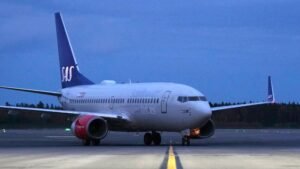 Small Training Aircraft Makes Emergency Landing In Hudson River, 2 Onboard Survive SEO DES: The aircraft, registered To American Airman Inc. was heavily damaged Both occupants were rescued by Coast Guard, Air Guard & police; FAA investigates SOCIAL: A small Cessna 172 training aircraft made a forced emergency landing on the icy Hudson River near the Newburgh–Beacon Bridge on the evening of March 2, 2026. The plane, which departed from Long Island MacArthur Airport, experienced in-flight difficulties and descended into the river around 7:55 p.m.. Both pilot and passenger survived with minor injuries. The aircraft, registered to American Airman Inc., sustained significant damage. A coordinated rescue involved the U.S. Coast Guard, Air National Guard, police, and fire departments. Authorities, including the FAA, are investigating the cause of the emergency landing. Officials praised first responders and likened the rescue to the 2009 “Miracle on the Hudson.” The flight had been following the Hudson River corridor, a common route for small aircraft, near Stewart International Airport, about 60 miles north of New York City. New York, United States: A small single-engine aircraft made a forced emergency landing on the icy waters of the Hudson River near the Newburgh-Beacon Bridge on the evening of Monday, March 2, 2026, authorities confirmed. The aircraft, a Cessna 172 Skyhawk, departed Long Island MacArthur Airport shortly before 7 p.m. local time and was later observed experiencing difficulties in flight, according to flight tracking and public reports. The pilot declared an emergency as the plane approached Stewart International Airport before descending into the Hudson River south of the bridge at around 7:55 p.m.. The aircraft bore the registration N1560E and is listed to American Airman Inc., a flight training organisation headquartered on Long Island, New York. The Cessna 172 is widely used in training and general aviation. Local officials and law enforcement confirmed that both people on board the pilot and a passenger survived the landing. They were recovered from the river and taken to nearby medical facilities. Early assessments indicate only minor injuries, and both individuals are expected to make a full recovery. The incident triggered a rapid and coordinated response from multiple agencies, including the U.S. Coast Guard, Air National Guard, state and local police, and fire departments. Emergency teams worked in freezing conditions amid floating river ice to locate and assist the occupants. New York Governor Kathy Hochul and Orange County Executive Steve Neuhaus praised the efforts of first responders. Neuhaus referenced the historic 2009 emergency landing on the Hudson of US Airways Flight 1549 dubbed the “Miracle on the Hudson” in commending the successful rescue of the smaller aircraft’s occupants. Initial reports suggest the Cessna sustained significant damage and may not be salvageable, with the wreckage expected to remain submerged and potentially serve as an artificial reef. The Federal Aviation Administration (FAA) has confirmed it is investigating the circumstances leading to the emergency landing. Official details on the cause whether mechanical failure, power loss, or another contributing factor have not yet been released. Final determination of the sequence of events will be part of the ongoing FAA inquiry. The flight had been transiting northward along the Hudson River corridor, a common route for small aircraft under visual flight rules prior to the emergency. The Hudson River under the Newburgh-Beacon Bridge lies roughly 60 miles north of New York City and is adjacent to general aviation traffic lanes near Stewart International Airport.