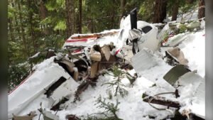 TSB Report Reveals Training Gaps Behind Fatal Chilliwack Flight Crash That Killed 2 SEO DES: The instructor’s limited mountain flying preparation and procedural lapses, including failure to file a flight plan or flight following, were key factors SOCIAL: A fatal training flight crash near Chilliwack, British Columbia, on April 5, 2025, that killed an instructor and student has been linked to inadequate mountain flying practices, according to a final report by the Transportation Safety Board of Canada. The Cessna 172S, operated by Chinook Helicopters (1982) Ltd., deviated from its planned instrument training route and entered mountainous terrain, where it attempted a low-speed turn in a confined valley. Investigators found the aircraft failed to maintain safe altitude, slowed below stall speed, and did not use flaps during the manoeuvre, leading to a loss of control and terrain impact. The instructor’s limited mountain flying preparation, along with procedural lapses such as failure to file a flight plan and lack of flight following, were key factors. The TSB also highlighted the absence of mandatory mountain flying training requirements in Canada as a broader safety concern. Abbotsford, Canada: A fatal training flight crash near Chilliwack, British Columbia, that claimed the lives of two pilots has been linked to inadequate mountain flying practices and gaps in preparation, according to a final investigation report released by the Transportation Safety Board of Canada. The accident occurred on April 5, 2025, when a Cessna 172S (registration C-GHCC) operated by Chinook Helicopters (1982) Ltd., a flight training school based in Abbotsford, departed Abbotsford Airport for what was planned as an instrument training flight. The aircraft was carrying one instructor and one student on board, both of whom lost their lives when the aircraft crashed into mountainous terrain. According to the final investigation report, the flight departed at approximately 12:28 PM local time and initially proceeded toward the Sumas practice area, commonly used by the flight school for training. However, instead of remaining within the designated training zone, the aircraft continued significantly farther east and south into mountainous terrain near Chilliwack Lake. Investigators were unable to determine why the flight deviated from its planned instrument training profile, noting that no portion of the flight was consistent with the intended instrument exercises discussed during the pre-flight briefing. As the aircraft entered a valley surrounded by rising terrain, it continued climbing but failed to achieve a safe altitude relative to the terrain ahead. Flight data showed that the aircraft slowed while maneuvering in the confined space and initiated a turning maneuver at low airspeed. During this turn, the aircraft’s speed decreased further, dropping below the stall threshold before it entered a descending turn and collided with terrain at approximately 4,000 feet above sea level around 1:00 PM. The impact forces were severe, and the crash was not survivable. The investigation found no evidence of mechanical failure. The aircraft, manufactured in 2007 and powered by a Lycoming engine, had undergone a recent inspection just days before the accident, and post-crash examination confirmed that all systems were functioning normally prior to impact. Weather conditions were also ruled out as a contributing factor. Instead, the Transportation Safety Board of Canada identified several critical shortcomings related to mountain flying techniques and operational decision-making. The aircraft was flown along the middle of the valley rather than maintaining a position along one side, a standard safety practice intended to preserve an escape route. When the crew attempted a course reversal commonly referred to as a canyon turn they did not use the full width of the valley, further reducing the margin for manoeuvring. In addition, the turn was initiated at a relatively low airspeed, which continued to decrease during the manoeuvre. Investigators determined that the aircraft’s speed fell below its stall speed, leading to a loss of control. The report also noted that the aircraft’s flaps remained retracted during the turn, despite their potential to reduce stall speed and improve turning performance in confined terrain. A significant factor highlighted in the report was the instructor’s limited mountain flying preparation. While the instructor had accumulated over 1,600 hours of flight experience, including extensive time on the aircraft type, his exposure to mountain flying was minimal and incomplete. The investigation found no evidence that he had received practical training for performing course reversals in actual mountainous terrain. Previous familiarization flights conducted years earlier did not constitute a full mountain flying qualification. The student, meanwhile, was an experienced helicopter pilot undergoing instrument rating training and had limited experience flying fixed-wing aircraft. This flight was intended to be the final fixed-wing component of that training. The report noted no issues related to medical condition or fatigue for either occupant. Beyond the in-flight factors, the investigation also identified procedural lapses. No flight plan or flight itinerary had been filed for the flight, despite regulatory requirements for operations beyond 25 nautical miles from the departure airport. The dispatch entry for the flight was incomplete, and no dedicated flight-following personnel were assigned on the day of the occurrence, as it was a weekend. These gaps reduced oversight and delayed situational awareness regarding the aircraft’s movements. The aircraft’s emergency locator transmitter activated as designed following the crash, enabling search and rescue teams to locate the wreckage approximately two hours and forty-one minutes later. However, due to the severity of the impact, there were no survivors. In response to the accident, Chinook Helicopters (1982) Ltd. has implemented several safety measures, including enhanced dispatch procedures, mandatory documentation of routes for flights into mountainous areas, simulator-based mountain flying training for instructors, and organization-wide safety briefings. The TSB emphasized a broader safety concern in its report, noting that there is no regulatory requirement in Canada for pilots to undergo formal mountain flying training. As a result, the responsibility falls on individual pilots and operators to ensure adequate preparation. Without such training, pilots may not fully understand the risks associated with confined-area manoeuvres in mountainous terrain or possess the skills required to execute them safely.