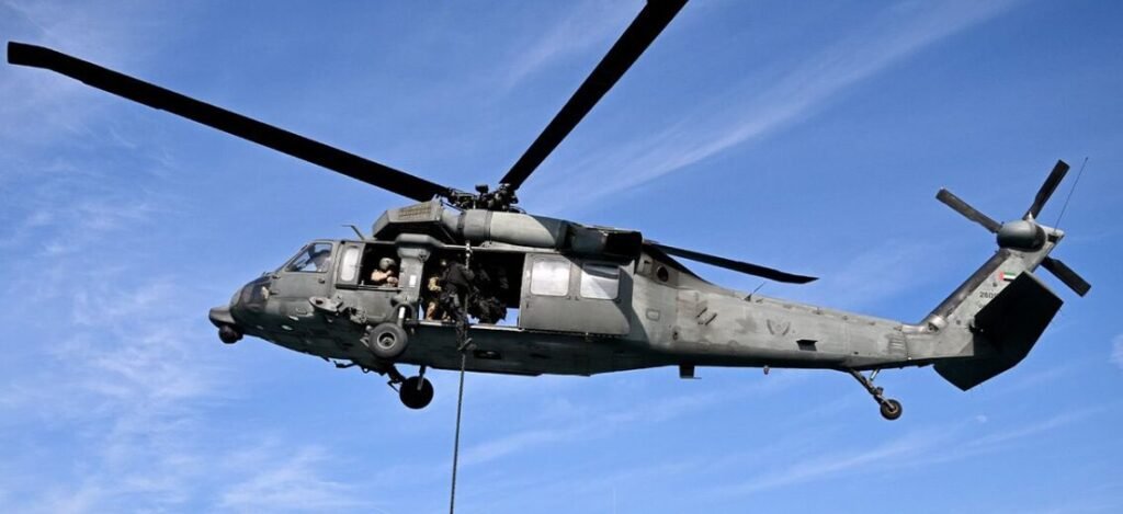 Two UAE Armed Forces Personnel Killed In Helicopter Crash Due To Technical Malfunction SEO DES: The helicopter crashed mid-flight due to a technical fault with no hostile action reported and details on the location or aircraft model yet to be released SOCIAL: On March 9, 2026, a UAE military helicopter crashed due to a technical malfunction, killing Captain Saeed Rashid Hamad Al Balushi and First Lieutenant Ali Saleh Ismail Al Tunaiji while on national duty. No hostile action was involved. The UAE Ministry of Defence described them as having “lost their lives while performing their national duty.” Full military funeral ceremonies were held on March 10 at Zayed Military Hospital, Abu Dhabi, attended by family, senior officials, and leaders. Separate funeral prayers took place in their home regions: Al Tunaiji in Ras Al Khaimah and Al Balushi in Al Ain. Senior Emirati leaders paid tribute and offered condolences to the families. Image: Ministry Of Defence (Representational Image) Video: Ministry Of Defence Abu Dhabi, United Arab Emirates: Two members of the United Arab Emirates (UAE) Armed Forces were killed on Monday, March 9, 2026, when a military helicopter crashed due to a technical malfunction while they were carrying out their national duties, the UAE Ministry of Defence has confirmed. According to the Ministry’s official statement, the helicopter went down mid‑flight after a technical fault caused it to crash. No hostile action has been reported in connection with the accident, and authorities have not released further details about the exact location of the incident or the specific aircraft model involved. The fallen crew were identified as Captain Pilot Saeed Rashid Hamad Al Balushi and first Lieutenant Pilot Ali Saleh Ismail Al Tunaiji. Both officers were serving in the UAE Armed Forces and were described by the Ministry as having “lost their lives while performing their national duty.” In a voice message shared publicly, First Lieutenant Al Tunaiji spoke about sacrifice and faith before his final mission, saying: “The great reward comes from the Lord of the worlds. If it is written that we are to be among the martyrs, then we shall be martyrs.” On Tuesday, March 10, 2026, the Ministry of Defence held full military funeral ceremonies for the two officers at Zayed Military Hospital in Abu Dhabi. The events were attended by family members, senior military officials, and leaders from across the UAE. Separate funeral prayers for the martyrs were also held in their respective home regions, a service for First Lieutenant Ali Saleh Ismail Al Tunaiji took place at Abdullah Ali Ibrahim Al Aamash Mosque in Ras Al Khaimah and a gathering for Captain Saeed Rashid Hamad Al Balushi was held at the Al Muatared Al Kabeer Mosque in Al Ain. Senior Emirati leaders, including military commanders and members of the ruling families, offered condolences to the grieving families and paid tribute to the officers’ dedication and service.