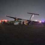 Safarilink Aircraft Veers Off Runway At Wilson Airport, All 39 Onboard Escape Unharmed SEO DES: Wet runway & low visibility caused loss of directional control during rollout, Aircraft sustained nose, landing gear & propeller damage; AAID probe underway SOCIAL: A Safarilink Aviation aircraft veered off the runway while landing at Wilson Airport on Friday night, carrying 39 people, including 34 passengers and five crew. All occupants escaped unharmed. The Flight 090 aircraft from Kisumu to Nairobi reportedly skidded off a wet runway and came to rest on a grassy area. The Kenya Airports Authority confirmed there were no injuries. The aircraft sustained damage to its nose, landing gear, and propeller. Adverse weather conditions are suspected as a contributing factor, while Kenya’s Aircraft Accident Investigation Department has launched a probe. Image: FL360aero Video: FL360aero Nairobi, Kenya: A Safarilink Aviation passenger aircraft veered off the runway while landing at Wilson Airport on Friday night, triggering fresh scrutiny over safety, infrastructure, and emergency preparedness at one of East Africa’s busiest domestic aviation hubs. The aircraft, operating as Flight 090 from Kisumu to Nairobi, was carrying 39 people onboard, including 34 passengers and five crew members, when the incident occurred at approximately 8:55 PM (2055 hrs). All occupants escaped without injury, authorities confirmed. According to airline and airport statements, the aircraft, a De Havilland DHC-8-100 (Dash 8) operated by ALS Limited on behalf of Safarilink skidded off the runway during landing and came to a stop on a grassy section near a runway intersection. The Kenya Airports Authority (KAA) confirmed the runway excursion in an official statement, “An aircraft with thirty nine passengers on board… veered off the runway, all passengers and crew are safe, with no injuries reported.” The aircraft sustained visible damage, including to its nose section, landing gear, and propeller, though no fire or fatalities occurred. Initial details point to adverse runway conditions as a contributing factor. The runway was reported to be wet due to rain, with reduced visibility at the time of landing The aircraft lost directional control during rollout, leading to the excursion Passengers described a sudden and forceful deviation from the runway, turning what should have been a routine landing into a high-risk situation. Among those onboard was Vihiga Senator Godfrey Osotsi, who described the incident as a “crash-landing” and credited the flight crew for preventing a catastrophe. “I commend the pilot… for controlling the aircraft and steering it off the runway, causing it to stall an action that averted what could have been a catastrophic fire,” he said. The manoeuvre likely prevented the aircraft from continuing at speed along the runway, reducing the risk of fire or structural breakup. Osotsi, speaking as a survivor, said all onboard escaped safely but highlighted the severity of the situation: “I came out safely from an aircraft accident… I was among the 39 passengers on board.” Passengers experienced a sudden loss of control during landing, followed by an abrupt stop after the aircraft exited the runway. No serious injuries were reported, and all occupants were safely evacuated. Despite the safe outcome, the incident has sparked serious concerns over airport safety systems. Osotsi alleged critical failures in emergency response, stating: No ambulance was present No immediate rescue or emergency team responded Passengers were initially left without assistance “There was no ambulance on site and no emergency response team came to our aid,” he said. Kenya’s Aircraft Accident Investigation Department (AAID) has launched a formal probe into the incident.