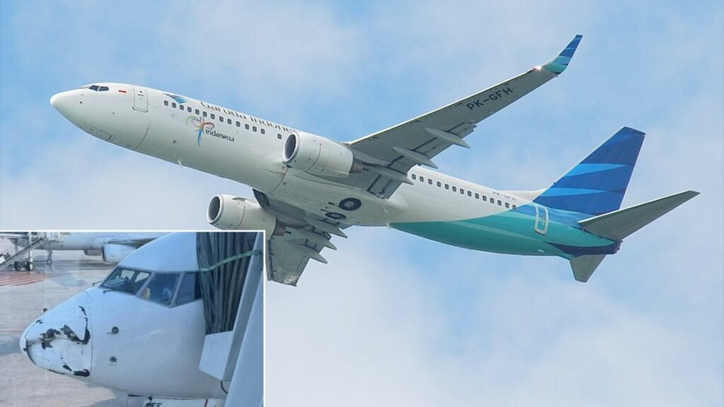 Garuda Indonesia Boeing 737 Lands With Severe Radome Damage Unnoticed During Flight SEO DES: Crew reported no issues & no injuries, the aircraft was grounded for checks the return flight cancelled & passengers were rebooked on Citilink flights SOCIAL: A Garuda Indonesia Boeing 737-800 operating flight GA176 landed safely in Pekanbaru after flying from Jakarta, where engineers later discovered severe damage to the aircraft’s nose radome during a post-flight inspection. The crew reported no abnormalities during the flight, and no injuries occurred. The aircraft was grounded for technical checks, the return flight was cancelled, and passengers were rebooked on alternative services including Citilink. Investigators are examining possible causes such as a bird strike, debris impact, hail, or ground damage. Image: Aero Lcarus (Flickr) Video: Radio Elshinta (X) Pekanbaru, Indonesia: A Garuda Indonesia Boeing 737-800 completed a domestic flight in Indonesia before engineers discovered significant structural damage to the aircraft’s nose radome, prompting an inspection and investigation into the cause of the incident. The aircraft, registered PK-GFF, was operating flight GA176 from Soekarno–Hatta International Airport to Sultan Syarif Kasim II International Airport when the damage occurred. The flight landed safely in Pekanbaru, and no injuries were reported among passengers or crew. According to aviation reports, the flight crew did not detect any abnormalities during the journey. The damage was discovered only after the aircraft arrived at the gate, when ground personnel and maintenance engineers conducted a routine post-flight inspection. Images circulating online showed the aircraft’s radome, the protective nose cone housing the weather radar suffering heavy visible damage. Following the discovery, the airline removed the aircraft from service for technical evaluation. The scheduled return flight from Pekanbaru to Jakarta was cancelled, and affected passengers were accommodated on alternative services, including flights operated by Citilink, the low-cost subsidiary of Garuda Indonesia. A radome is made of lightweight composite material designed to allow radar signals to pass through while protecting sensitive avionics equipment. Because it sits outside the pilots’ field of view and is not a load-bearing structure, certain types of external damage may not immediately produce cockpit alerts or noticeable flight-handling changes. The exact cause of the damage remains under investigation. There can be several possible scenarios, including a bird strike, impact with airborne debris, hail, or damage sustained prior to departure during ground operations. The airline has not yet confirmed the definitive cause. Despite the extent of the visible damage, aviation safety experts note that the aircraft’s safe landing indicates that critical systems continued functioning normally during the flight.