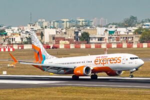 Air India Express Flight Makes Emergency Landing In Lucknow After Mid-Air Smoke Alert SEO DES: Oxygen masks were deployed inside the cabin, leading to panic among passengers. The aircraft carrying 148 people diverted safely with no injuries SOCIAL: A Delhi-bound Air India Express flight (IX 1523) made an emergency landing in Lucknow after a Mayday call over suspected onboard smoke. The aircraft, carrying 148 people, diverted safely with no injuries. Oxygen masks were deployed mid-air, causing panic, while authorities activated full emergency response on ground. Post-landing checks found no visible smoke or fire; the aircraft had been grounded for detailed inspection, and passengers were provided alternate arrangements. Lucknow, India: A Delhi-bound Air India Express flight made an emergency landing at Chaudhary Charan Singh International Airport on Monday evening after the crew issued a Mayday call following suspected smoke inside the aircraft, triggering a full-scale emergency response. Flight IX 1523, operating from Bagdogra to Delhi, declared the distress call at around 4:58 pm while cruising at approximately 36,000 feet over Uttar Pradesh’s Ambedkar Nagar region. There were 148 passengers and crew onboard. The cockpit reportedly received indications of possible smoke from onboard systems, prompting immediate emergency procedures. As a precautionary measure, oxygen masks were deployed inside the cabin, leading to panic among passengers. Crew members managed the situation while coordinating with air traffic control for a diversion. Following the Mayday alert, authorities at Lucknow airport declared a full emergency, with fire tenders, medical teams, and rescue personnel placed on standby ahead of the aircraft’s arrival. The flight was diverted and landed safely at the airport, where emergency protocols were executed in line with standard aviation safety procedures. All passengers and crew onboard were safely evacuated, and no injuries were reported. Initial inspections conducted after landing did not detect any visible smoke or fire despite the earlier cockpit indications. The aircraft has since been grounded as a precaution and will undergo detailed technical checks before being cleared for further operations, according to reports. Passengers experienced delays and uncertainty regarding onward travel, with arrangements being made for alternate flights and assistance as required.