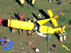 Berrima, Australia: A pilot suffered critical injuries after a light aircraft crashed into a paddock in the Southern Highlands region of New South Wales on Thursday morning, triggering a large-scale emergency response and an ongoing investigation into the cause of the accident. Emergency services were called to Medway Road in Berrima at approximately 7:45–7:50 am on April 16, 2026, following reports that a small aircraft had gone down in an open field. Responding crews, including police, Fire and Rescue NSW, NSW Ambulance, the State Emergency Service (SES), and the Rural Fire Service, arrived to find a severely damaged recreational plane with its sole occupant trapped inside the wreckage. The aircraft has been identified as a Hornet STOL ultralight, a small fixed-wing aluminium recreational plane. Initial information indicates the aircraft came down under unknown circumstances, with no immediate indication of the cause. The pilot, a man believed to be in his 50s, was trapped inside the wreckage “for some time” before firefighters were able to extricate him in a complex rescue operation. Paramedics treated the man at the scene for significant face and leg injuries before he was airlifted by helicopter to Liverpool Hospital. Authorities confirmed he remains in critical condition. The crash prompted a substantial multi-agency emergency deployment. Fire and Rescue NSW dispatched at least five units, including specialised HAZMAT crews, who worked to isolate a minor fuel leak and mitigate the risk of fire at the crash site. NSW Ambulance deployed multiple crews along with two helicopters, while police and other emergency services secured the area and assisted in the rescue effort. Aerial footage from the scene showed the aircraft described as a yellow plane with red markings lying heavily damaged in a paddock as emergency personnel worked around the wreckage. New South Wales Police have launched an investigation into the incident, and aviation authorities have been notified. The Australian Transport Safety Bureau (ATSB) confirmed it is aware of the crash, although it typically investigates recreational aircraft incidents only in exceptional circumstances. At this stage, the circumstances leading up to the crash remain unclear, and no further details have been released regarding the flight’s origin, intended destination, or weather conditions at the time of the incident.