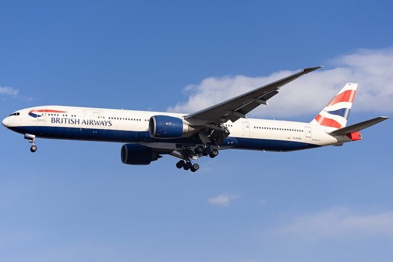 London, United Kingdom: A British Airways Boeing 777 operating flight BA2203 from London Gatwick to Cancun was forced to make an emergency return shortly after departure following reports of fumes inside the aircraft. The long-haul flight had departed Gatwick in the afternoon on April 27, 2026 and climbed to approximately 11,000 feet when crew and passengers began noticing a strong, unusual odor inside the cabin. Several onboard described the smell as similar to “dirty socks,” with some reporting dizziness and nausea as the situation developed. Recognizing the seriousness of the issue, the flight crew declared a full emergency and initiated immediate safety procedures. Oxygen masks were deployed, and pilots donned protective equipment while working to manage the situation in the cockpit. As part of standard emergency protocol, the aircraft entered a holding pattern to reduce landing weight by burning fuel. During this period, pilots also took additional measures to ventilate the cockpit, including opening cockpit windows while operating at lower altitude. The Boeing 777 remained airborne for approximately 45 minutes before safely returning to London Gatwick Airport. Emergency services were deployed on standby as the aircraft landed without further incident. Medical teams assessed passengers and crew after landing, with some individuals requiring precautionary checks following exposure to the fumes. The airline arranged assistance and accommodation for affected passengers after the flight was subsequently delayed. In an official statement, British Airways confirmed that the diversion was due to a “technical issue” and stated that the aircraft “landed safely,” adding that customers disembarked normally and the airline apologised for the disruption caused. A replacement aircraft was later arranged to continue the journey to Cancun after the incident led to a significant delay.