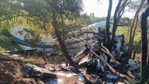 Minga Guazú, Paraguay: A cash transport aircraft operating for security firm Prosegur crashed in eastern Paraguay, triggering chaos at the crash site where locals looted an estimated $2 million in cash, authorities confirmed. The incident occurred on April 18, 2026, near Minga Guazú, close to Guaraní International Airport, involving a Cessna 402B twin-engine aircraft registered to Aerotax and operating on behalf of Prosegur. According to Paraguay’s National Directorate of Civil Aeronautics (DINAC), the aircraft was en route from Ciudad del Este to Asunción, transporting large cash consignments. There were four people onboard: Two crew members Two Prosegur employees The pilot was killed, while the remaining three occupants sustained injuries and were transported to hospitals. Preliminary findings indicate that the aircraft suffered a left engine failure mid-flight, which led to the crash. Authorities have emphasized that this remains an early assessment, with a full technical investigation underway. The aircraft was carrying: Approximately $5 million USD Around 15 million Brazilian reais The cash was being transported as part of a secured logistics operation managed by Prosegur. Within minutes of the crash, the situation escalated rapidly. Police reported that residents reached the wreckage within about 15 minutes, before security forces could fully secure the area. According to Commissioner Carlos Duré, people “approached the place and appropriated the money,” leading to large-scale looting. Authorities estimate that around $2 million is now missing, though the exact amount remains difficult to verify due to the nature of cash transport. Officials have raised concerns about organized criminal exploitation in the aftermath of the crash. Reports indicate that some individuals have been posing as law enforcement officers and visiting homes in an attempt to recover or extort looted cash. Authorities confirmed that at least one such incident has already been recorded. Residents have been urged to remain cautious and to report any suspicious activity to the police. The investigation remains ongoing, with multiple agencies involved in determining the full circumstances of the incident. Key areas of focus include confirming the exact cause of the reported engine failure, accounting for the missing cash, and identifying those involved in the looting. Officials noted that tracking the stolen money poses a significant challenge, as the funds were being transported in physical cash without traceable markers. Authorities have secured the crash site, while the injured survivors continue to receive medical treatment. Search and recovery operations have been completed, and investigators are now concentrating on both the technical aspects of the crash and the post-incident looting.