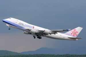 Whitehorse, Canada: A China Airlines cargo aircraft was forced to make an emergency diversion to northern Canada after a smoke alarm was triggered mid-flight, prompting a precautionary response from the flight crew. The incident occurred on April 18, 2026, when a China Airlines Boeing 747-400 freighter was en route on a trans-Pacific cargo sector and experienced a cockpit warning indicating possible smoke onboard. The crew responded in line with standard aviation safety procedures by declaring an emergency and diverting the aircraft to Erik Nielsen Whitehorse International Airport, the nearest suitable airport along its route. The aircraft landed safely in Whitehorse, with emergency services on standby as a precaution. Authorities confirmed that there were no injuries among crew members, and no visible signs of fire or smoke were detected after landing. Initial reports indicate that the smoke warning originated from onboard detection systems, which are designed to trigger alerts even in the absence of an actual fire. Aviation protocols require immediate action in such scenarios due to the high risk associated with in-flight cargo fires. The cargo jet was reportedly operating a Chicago-Anchorage route, part of a common polar cargo corridor used for trans-Pacific freight operations. Whitehorse frequently serves as an alternate diversion airport for aircraft operating in northern airspace due to its strategic location and long runway capability. Following the landing, the aircraft underwent inspection on the ground in Whitehorse. While authorities have not publicly confirmed the exact cause of the warning, early indications suggest the alert may have been precautionary rather than linked to an active onboard fire. The aircraft was later cleared to depart after necessary checks were completed.