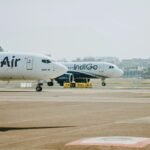 New Delhi, India: India has formally allowed the blending of sustainable aviation fuel (SAF), ethanol and other synthetic hydrocarbons into aviation turbine fuel (ATF), marking a significant regulatory shift aimed at reducing emissions and lowering dependence on imported crude oil. The move follows an amendment to the Aviation Turbine Fuel (Regulation of Marketing) Order, 2001, issued by the Ministry of Petroleum and Natural Gas under the Essential Commodities Act. The revised framework expands the legal definition of ATF to include not only conventional hydrocarbons but also blends incorporating synthetic and renewable components. With the amendment now in force, India has effectively granted legal recognition to SAF and other alternative aviation fuels, allowing their integration into the country’s aviation fuel ecosystem for the first time. The updated rules define ATF as a mixture of hydrocarbons conforming to IS 1571 standards or blends with synthetic hydrocarbons under IS 17081 specifications, enabling the inclusion of newer, cleaner fuel variants. The notification also aligns enforcement provisions with updated criminal procedure laws, modernising the regulatory framework governing fuel marketing and distribution. Despite enabling SAF blending, the government has not introduced mandatory blending requirements at this stage. However, India has already outlined a phased roadmap for SAF adoption in international aviation: 1% blending by 2027 2% by 2028 5% by 2030 No targets have been specified for domestic flights so far, indicating a gradual, phased transition strategy. The policy aims to address two major strategic priorities: decarbonisation and energy security. India currently relies heavily on crude imports, with a significant portion of aviation fuel derived from fossil sources. By enabling SAF blending, the government seeks to reduce emissions while diversifying fuel sources and lowering import dependence. Globally, SAF is produced from renewable feedstocks such as waste oils, agricultural residues, municipal waste and even captured carbon, offering a lower lifecycle carbon footprint compared to conventional jet fuel. The move positions India alongside global efforts to decarbonise aviation under the Carbon Offsetting and Reduction Scheme for International Aviation (CORSIA) led by the International Civil Aviation Organisation (ICAO). CORSIA will become mandatory for most countries from 2027, requiring airlines to offset emissions above 2020 levels and accelerating the adoption of cleaner fuels such as SAF. Several countries, including the UK and Japan, have already introduced SAF blending mandates, and India’s regulatory update signals its intent to align with these international trends. While SAF offers environmental benefits, it remains more expensive than conventional jet fuel, posing cost challenges for airlines in the near term. However, policymakers expect that scaling domestic production particularly using ethanol and alcohol-to-jet pathways could improve cost competitiveness over time and create new opportunities in India’s biofuel sector. Industry stakeholders also view the move as a critical first step that enables investment, production capacity development and long-term fuel transition planning. The latest amendment does not mandate immediate operational changes for airlines but establishes the legal and regulatory foundation required for SAF adoption in India’s aviation sector. By bringing alternative aviation fuels under the formal definition of ATF, the government has removed a key regulatory barrier, signalling a long-term transition toward cleaner aviation fuel systems.