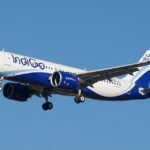Gurugram, India: India’s largest airline, IndiGo, has become the first airline globally to receive 500 Airbus aircraft directly from Airbus, marking a major milestone in commercial aviation and emphasizing the carrier’s rapid scale-up over the past two decades. The landmark aircraft, an Airbus A320neo registered VT-ION was inducted earlier this month without ceremony, reflecting the airline’s cost-focused, efficiency-driven operating philosophy. IndiGo’s achievement places it ahead of legacy global carriers in terms of direct Airbus deliveries. Among passenger airlines, Lufthansa trails with around 466 aircraft, while China Eastern Airlines has received about 449, according to industry data. While aircraft leasing companies such as AerCap have handled higher volumes, IndiGo remains the largest operator to receive aircraft directly as an airline, setting a new global benchmark. As of March 2025, the airline had taken delivery of 499 Airbus aircraft, with additional deliveries in April pushing the total beyond the 500 mark. The milestone traces back to a bold move in 2005, when IndiGo’s parent, InterGlobe Aviation, placed an order for 100 Airbus aircraft at the Paris Air Show, a decision widely questioned at the time given the limited scale of India’s aviation market. At that point, even state-run carriers such as Air India and Air India Express together operated a fleet of just over 40 aircraft, highlighting the scale of IndiGo’s ambition. The airline later became the launch customer for the A320neo family, which now forms the backbone of its high-frequency, low-cost domestic and regional network. IndiGo also leads Airbus’ global order book, with approximately 1,400 aircraft committed, the largest such backlog worldwide. Of these, around 899 aircraft are yet to be delivered over the next decade, positioning the airline for sustained expansion. The order pipeline includes: A320neo and A321neo family aircraft (core narrow-body fleet) A321XLR aircraft, enabling longer-range narrow-body routes Around 60 Airbus A350-900 widebody aircraft, marking IndiGo’s entry into long-haul international operations However, deliveries of widebody aircraft have faced delays due to global supply chain constraints, industry reports noted. The induction of A350 aircraft represents a significant strategic shift for IndiGo, traditionally known for its low-cost, short-haul model. The widebody fleet will support the airline’s ambition to expand into long-haul international markets, a segment currently dominated by foreign carriers. The airline has also begun inducting A321XLR aircraft, strengthening its medium-haul international connectivity. The milestone comes amid a challenging phase for the aviation sector, including rising fuel prices and geopolitical headwinds in West Asia, as well as IndiGo’s own operational disruptions in late 2025. Despite these challenges, IndiGo continues to maintain its dominant position in India’s aviation market and is pursuing aggressive fleet and network expansion.