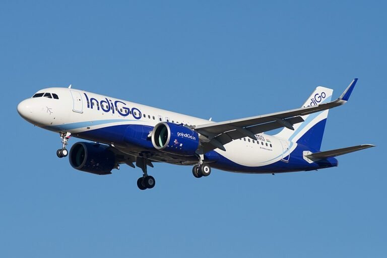 Gurugram, India: India’s largest airline, IndiGo, has become the first airline globally to receive 500 Airbus aircraft directly from Airbus, marking a major milestone in commercial aviation and emphasizing the carrier’s rapid scale-up over the past two decades. The landmark aircraft, an Airbus A320neo registered VT-ION was inducted earlier this month without ceremony, reflecting the airline’s cost-focused, efficiency-driven operating philosophy. IndiGo’s achievement places it ahead of legacy global carriers in terms of direct Airbus deliveries. Among passenger airlines, Lufthansa trails with around 466 aircraft, while China Eastern Airlines has received about 449, according to industry data. While aircraft leasing companies such as AerCap have handled higher volumes, IndiGo remains the largest operator to receive aircraft directly as an airline, setting a new global benchmark. As of March 2025, the airline had taken delivery of 499 Airbus aircraft, with additional deliveries in April pushing the total beyond the 500 mark. The milestone traces back to a bold move in 2005, when IndiGo’s parent, InterGlobe Aviation, placed an order for 100 Airbus aircraft at the Paris Air Show, a decision widely questioned at the time given the limited scale of India’s aviation market. At that point, even state-run carriers such as Air India and Air India Express together operated a fleet of just over 40 aircraft, highlighting the scale of IndiGo’s ambition. The airline later became the launch customer for the A320neo family, which now forms the backbone of its high-frequency, low-cost domestic and regional network. IndiGo also leads Airbus’ global order book, with approximately 1,400 aircraft committed, the largest such backlog worldwide. Of these, around 899 aircraft are yet to be delivered over the next decade, positioning the airline for sustained expansion. The order pipeline includes: A320neo and A321neo family aircraft (core narrow-body fleet) A321XLR aircraft, enabling longer-range narrow-body routes Around 60 Airbus A350-900 widebody aircraft, marking IndiGo’s entry into long-haul international operations However, deliveries of widebody aircraft have faced delays due to global supply chain constraints, industry reports noted. The induction of A350 aircraft represents a significant strategic shift for IndiGo, traditionally known for its low-cost, short-haul model. The widebody fleet will support the airline’s ambition to expand into long-haul international markets, a segment currently dominated by foreign carriers. The airline has also begun inducting A321XLR aircraft, strengthening its medium-haul international connectivity. The milestone comes amid a challenging phase for the aviation sector, including rising fuel prices and geopolitical headwinds in West Asia, as well as IndiGo’s own operational disruptions in late 2025. Despite these challenges, IndiGo continues to maintain its dominant position in India’s aviation market and is pursuing aggressive fleet and network expansion.