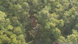 Melawi, Indonesia: All eight people on board a helicopter were killed after the aircraft crashed in a remote, forested area of Indonesia’s West Kalimantan province, authorities confirmed on Friday, following an overnight search operation that located the wreckage in difficult terrain. The aircraft, identified as an Airbus H130 helicopter operated by Matthew Air Nusantara, lost contact shortly after takeoff on Thursday morning while flying within Melawi district in Borneo island. According to Indonesia’s National Search and Rescue Agency (Basarnas), the helicopter disappeared from radar approximately five minutes after departure from a plantation helipad and was later found crashed about 3 kilometres from its last known contact point, in a densely forested and hilly area. “The location of the crash or loss of contact is in a densely forested area with steep hilly terrain,” said Mohammad Syafii, head of Basarnas, as quoted by Reuters. Officials confirmed that the aircraft carried six passengers and two crew members, all of whom died in the crash. The 2 crew members were identified as Pilot in Command, Captain Marindra W, and Engineer on Board, Harun Arasyid along with 6 passengers Patrick K, Victor T, Charles L, Joko C, Fauzie O, and Sugito. Rescue teams recovered wreckage, including parts believed to be the tail section of the helicopter, during the search operation involving military and police units. The plantation area from which the helicopter departed is reportedly owned by the palm oil company Citra Mahkota, according to rescue officials cited in international reports. Search and recovery efforts were significantly slowed due to dense jungle terrain and steep hills, forcing rescue teams to rely on combined aerial reconnaissance and ground movement through difficult forest access routes. Authorities have not yet determined the cause of the crash. Investigators are currently examining all possible factors, including mechanical failure and weather conditions, though no official conclusion has been released. “The cause of the crash remains unclear,” Basarnas officials said, confirming that a full investigation is underway.