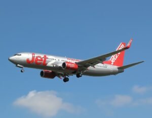 Faro, Portugal: A Jet2 Boeing 737-800 operating flight LS3643 from Bournemouth, United Kingdom, to Gran Canaria, Spain, made an emergency landing at Faro Airport in Portugal on April 16, 2026, after crew reported smoke inside the cabin during the flight. The aircraft, carrying 141 passengers, departed Bournemouth at approximately 09:54 BST on a routine service to the Canary Islands. While cruising at altitude, the flight crew detected smoke or fumes in the cabin, prompting them to declare a technical emergency and initiate an immediate diversion to Faro, the nearest suitable airport along the route. According to Portuguese civil protection authorities and airport officials, the pilots issued an emergency call shortly before landing. The aircraft touched down safely at Faro at approximately 12:24 local time, around two and a half hours after departure, with no injuries reported among passengers or crew. Faro Airport activated its emergency response protocols in advance of the landing. The operation triggered the airport’s preliminary intervention plan, leading to the deployment of around 95 personnel and 41 emergency vehicles, including firefighters, police units, and medical teams. Emergency crews were positioned strategically along the runway to ensure rapid response if required. Passengers disembarked normally after landing while the aircraft was taken for technical inspection to determine the source of the smoke. Authorities have not yet confirmed the exact cause of the incident. Some reports described the situation onboard as tense, with cabin smoke prompting a full emergency alert at the airport. A “red code” response was activated, mobilizing dozens of emergency vehicles and personnel as a precautionary measure, though the landing itself was conducted safely without further escalation. The aircraft remains under technical evaluation in Faro as investigations continue into the source of the smoke. The airline has not reported any injuries, and further updates are expected following inspection results.