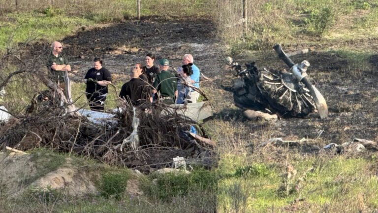 Williston, United States: A fatal crash involving a vintage military training aircraft claimed two lives near Williston Regional Airport on Sunday afternoon, prompting a federal investigation into the circumstances surrounding the accident. According to local authorities and multiple reports, the incident occurred at approximately 3:30 PM on April 13, 2026, when a North American AT-6D Texan, a historic single-engine aircraft, went down a few miles from the airport in Levy County. The crash site was located near the intersection of Northeast 30th Street and 114th Avenue. Emergency responders, including Levy County Sheriff’s deputies and fire rescue teams, arrived quickly at the scene following reports from witnesses. Officials confirmed that both individuals onboard the aircraft were killed in the crash. Their identities have not yet been released. The aircraft involved, the AT-6 Texan, is a World War II-era trainer widely used by the U.S. military between the 1930s and 1950s. Such aircraft are typically privately owned today and maintained as part of the warbird and vintage aviation community. Preliminary information indicates that the aircraft may have been a restored example in civilian operation. Authorities secured the area shortly after the crash and advised the public to avoid the vicinity while recovery and investigative efforts were underway. No injuries on the ground or damage to nearby structures have been reported so far. The Federal Aviation Administration (FAA) and the National Transportation Safety Board (NTSB) have launched a joint investigation into the accident. Officials will examine multiple factors, including the aircraft’s maintenance history, pilot credentials, weather conditions at the time of the crash, and any available flight data or eyewitness accounts. As of now, the cause of the crash remains undetermined. Investigators are expected to release further details in the coming days as evidence is analyzed. In another incident on April 10, 2026, a small aircraft crashed in Okaloosa County, Florida, after experiencing a complete engine failure, leaving two people injured. According to the Okaloosa County Sheriff’s Office, the aircraft, identified as a two-seat Cub, went down near the Baker area shortly after takeoff from a local airstrip. The pilot reported that the engine failed completely at an altitude of about 200 feet while conducting a low flyover, causing the aircraft to descend and crash onto private property. The pilot was able to exit the aircraft and call emergency services, while the passenger was trapped and had to be extricated by rescue teams. Both occupants were conscious when responders arrived and were transported to hospital, one by ground and the other airlifted as a precaution. Authorities are investigating the incident