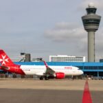 Valletta, Malta: A KM Malta Airlines flight bound for Paris was forced to return to Malta shortly after departure due to a cockpit crew planning error that breached internal training requirements, according to airline statements. Flight KM478, operating from Malta International Airport to Paris Charles de Gaulle, departed as scheduled early in the morning but turned back less than 30 minutes into the journey after the captain identified a discrepancy in crew composition. The aircraft was being operated with a trainee co-pilot (cadet) who, under aviation regulations and company procedures, must be supervised by a qualified training captain. However, the assigned captain on the flight was not certified as an instructor, rendering the operation non-compliant with internal and regulatory training standards. The issue came to light shortly after departure, as the aircraft approached airspace near Sicily. Upon identifying the irregularity, the captain decided to discontinue the flight and return to Malta as a precautionary measure. Flight tracking data shows the aircraft deviating from its planned route, looping near the Sicilian coast before heading back. The flight then entered a holding pattern to burn fuel and reduce landing weight before safely landing at Malta International Airport. The aircraft remained airborne for approximately 90 minutes, including the time spent circling prior to landing. The airline emphasized that the return was a procedural and precautionary decision, not driven by any technical fault or safety emergency. In statements the airline confirmed that: The aircraft was fully airworthy All crew members held valid licenses Passenger safety was never at risk The captain acted in line with the airline’s “safety-first” operational philosophy after determining that the crew configuration did not meet internal requirements. Preliminary findings indicate that the incident was caused by an administrative or rostering error, which led to the trainee pilot being paired with a regular captain instead of a training-qualified instructor. Aviation regulations require cadet pilots to operate under the supervision of specially qualified training captains during line training flights, making such pairing essential for compliance. Following the safe return, affected passengers were accommodated on a later flight operated with a compliant crew composition. The airline has apologised to passengers and launched an internal investigation to determine how the error occurred and to implement measures to prevent a recurrence.