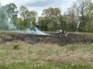 New Market, United States: Two people were killed after a small twin-engine aircraft crashed into a field in New Market, Jefferson County, on Monday afternoon, prompting a joint investigation by the Federal Aviation Administration (FAA) and the National Transportation Safety Board (NTSB). According to authorities, the Beechcraft 58 aircraft went down near Burchell Road at approximately 1:10 p.m. local time on Monday, April 13, while operating in East Tennessee airspace. Emergency services were alerted shortly after the crash and arrived to find the aircraft wreckage in a rural field, with a post-impact fire reported at the scene. Officials confirmed that both occupants on board died on impact. No injuries were reported on the ground. The New Market Volunteer Fire Department, along with Jefferson County Sheriff’s Office, EMS, and emergency management teams, responded within minutes. Fire crews reported a burn area surrounding the wreckage, estimated at roughly 30 yards in diameter, following the impact. Witnesses in the area described hearing a loud explosion followed by heavy smoke rising from behind wooded terrain, with residents assisting first responders in locating the crash site. The FAA confirmed the aircraft type as a Beechcraft 58 and stated that only two individuals were aboard at the time of the accident. The NTSB has taken the lead in the investigation, with officials arriving at the scene to document wreckage before transporting it for detailed examination. Investigators will focus on multiple aspects, including flight path data, aircraft maintenance history, pilot records, air traffic control communications, and weather conditions at the time of the crash. The wreckage is expected to be moved to a secure facility for further analysis as part of the ongoing investigation. A preliminary report from the NTSB is expected in the coming weeks. Authorities have not yet released the identities of the victims, pending official identification by the Knox County Regional Forensic Center. The crash remains under active investigation.