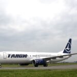 Bucharest, Romania: A serious in-flight medical emergency involving a TAROM Boeing 737 has raised renewed concerns over pilot fatigue after a co-pilot collapsed during a scheduled European service, prompting an emergency response and regulatory scrutiny. The incident occurred on April 16, 2026, during a return flight operated by Romania’s national carrier TAROM from Amsterdam Schiphol Airport to Bucharest Henri Coandă International Airport. The 57-year-old co-pilot had not slept the night before reporting for duty, a factor that investigators later identified as central to the event. The crew had earlier completed an outbound sector from Bucharest to Amsterdam, during which the co-pilot reportedly felt unwell. Despite his condition, he continued operating and joined the return flight shortly after arrival, reflecting a tight turnaround schedule. During the return leg, the co-pilot’s condition deteriorated. Reports indicate that approximately 50 minutes after departure he began feeling worse, and about 2 hours and 40 minutes into the flight, he lost consciousness in the cockpit. The captain declared an emergency and continued the flight, ensuring a safe landing in Bucharest. Medical teams were positioned on arrival and boarded the aircraft immediately to attend to the incapacitated crew member. Passengers reported to be 87 onboard were disembarked via rear stairs to allow rapid access to the cockpit. Initial findings reported that the pilot’s collapse was linked to extreme fatigue after “not sleeping a wink the night before,” reinforcing the seriousness of the situation. Romanian aviation authorities classified the occurrence as a “serious safety event,” citing the direct implications of cockpit incapacitation during flight.