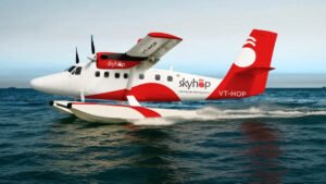 Rishikesh, India: India’s emerging seaplane operator SkyHop Aviation has successfully completed a key test flight at the Ganga Barrage in Rishikesh, marking a significant step toward launching the country’s first private commercial seaplane services. The trial, conducted earlier this week, involved a De Havilland Canada DHC-6 Twin Otter fitted with amphibious floats, enabling it to take off from and land on water. The aircraft executed multiple water operations during the demonstration, validating its performance in riverine conditions and underscoring the feasibility of seaplane services in India’s inland waterways. The development comes as SkyHop moves closer to operational readiness, having already secured a No-Objection Certificate (NOC) and now progressing toward obtaining an Air Operator Certificate (AOC) from the Directorate General of Civil Aviation. Regulatory clearance remains the final milestone before commercial deployment. According to company officials, the test is part of a broader plan to introduce scheduled and charter seaplane services connecting remote and underserved regions, particularly areas where conventional airport infrastructure is limited or unviable. The airline has identified island territories and coastal regions as priority markets, with initial operations expected to focus on routes linking the mainland with Lakshadweep. The Twin Otter platform, widely used in rugged and short-haul environments globally, offers seating for up to 19 passengers and is known for its short take-off and landing capabilities. Its amphibious configuration allows operations from both land runways and water bodies, making it suitable for India’s diverse geography, which includes extensive coastlines, rivers, and inland water systems. The test was a revival of India’s seaplane ambitions, which have seen limited progress despite earlier government-backed initiatives under the regional connectivity framework. If successfully scaled, seaplane operations could complement existing aviation networks by reducing travel time to remote destinations and opening new tourism corridors. However, challenges remain. Experts point to the need for clear regulatory frameworks for water aerodromes, coordination with local authorities, environmental clearances, and seasonal variability in water levels, particularly in river-based operations. Commercial viability will also depend on pricing, demand generation, and infrastructure readiness at potential destinations. Despite these hurdles, SkyHop’s successful demonstration at Rishikesh signals renewed momentum in India’s niche aviation segment. With certification processes underway, the coming months will be critical in determining whether seaplane services can transition from experimental trials to a sustainable commercial model in the country.