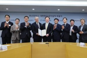 Busan, South Korea: Korean Air and the Busan Metropolitan Government have formalised a major aerospace development initiative through a memorandum of understanding (MOU) to establish a large-scale unmanned aircraft manufacturing facility in western Busan. The agreement marks a strategic expansion of South Korea’s aerospace and defence manufacturing ecosystem, with a focus on next-generation unmanned aerial systems (UAS), artificial intelligence-driven aviation technologies, and aircraft component production. Under the agreement, Korean Air will invest approximately ₩200 billion (about $145 million) to construct and operate the new facility within the Busan Tech Center complex. The planned development site will span around 52,892 square meters, making it one of the significant aerospace infrastructure projects tied to the city’s long-term industrial diversification strategy. The facility will be dedicated to multiple aerospace functions, including the manufacturing of unmanned aerial vehicles (UAVs), development of AI-enabled autonomous flight systems, production of aircraft structural components, and expansion of maintenance, repair, and overhaul (MRO) capabilities. The project is expected to enhance Korean Air’s position beyond its core airline operations, strengthening its aerospace manufacturing and defence-related aviation portfolio. The agreement aligns with Busan’s broader ambition to develop an integrated aviation and aerospace industrial cluster, particularly in connection with future aviation infrastructure projects such as the Gadeokdo New Airport aviation ecosystem plan. Local authorities view the initiative as a catalyst for attracting high-value aerospace investment, research activity, and skilled employment in the region. The MOU was signed on March 30, 2026 during an official ceremony attended by senior representatives from both sides. The Busan Metropolitan Government was represented by Mayor Park Heong-joon, while Korean Air was represented by Vice Chairman Woo Kee-hong, according to local government and media reports. Both sides emphasised the project’s potential to position Busan as a competitive hub for advanced aviation manufacturing and unmanned systems development in Northeast Asia. Officials noted that the agreement currently remains a non-binding MOU, meaning it serves as a framework for cooperation rather than a finalized construction contract. Detailed investment execution plans, regulatory approvals, land development procedures, and project timelines are expected to be finalized in subsequent phases of implementation. Korean Air has been steadily expanding its aerospace division in recent years, investing in areas such as unmanned aerial systems, aircraft structures manufacturing, and defence aviation technologies. The Busan project is widely viewed as part of this long-term strategic shift toward high-value aerospace engineering and future mobility solutions. The initiative is also expected to strengthen South Korea’s domestic UAV industry and enhance its competitiveness in the global aerospace supply chain, particularly as demand rises for autonomous systems in both civilian and defence applications.
