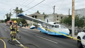 Phoenix, United States: A small aircraft was forced to make an emergency landing on a busy roadway in Phoenix, Arizona, on April 12, 2026, injuring three people onboard and triggering an investigation by federal aviation authorities. The incident occurred at approximately 2:37 p.m. local time near the intersection of 7th Street and Missouri Avenue, a densely trafficked corridor in the city. The single-engine aircraft descended into the urban area and ultimately landed on the roadway, narrowly avoiding vehicles, pedestrians, and surrounding infrastructure. Officials noted that the pilot’s handling of the emergency likely prevented a far more serious crash, as the aircraft did not collide with any cars or buildings despite the challenging environment. Witness accounts and initial reports indicate the aircraft came down in close proximity to active traffic lanes, reflecting the risk posed by the situation. Emergency services responded promptly to the scene. Authorities confirmed that three individuals onboard the aircraft sustained minor injuries, consistent across multiple reports. All occupants were able to exit the aircraft without assistance before first responders arrived. They were treated at the scene, and none required transportation to a hospital. The aircraft was identified as a Republic RC-3. During the emergency descent, the pilot reportedly attempted to avoid overhead power lines while identifying a viable landing zone. The aircraft is also believed to have struck a water main upon landing, resulting in localized disruption, including water leakage and additional hazards for emergency crews managing the scene. Following the incident, authorities shut down portions of the roadway to allow for emergency response, aircraft recovery, and preliminary investigative work. Traffic in the area was significantly impacted for several hours as crews secured the site and assessed potential infrastructure damage. No injuries were reported among individuals on the ground, a factor officials highlighted as notable given the location and timing of the emergency landing. The Federal Aviation Administration (FAA) and the National Transportation Safety Board (NTSB) have initiated an investigation into the incident. Authorities have not yet determined the cause of the emergency, and further details are expected as the investigation progresses.