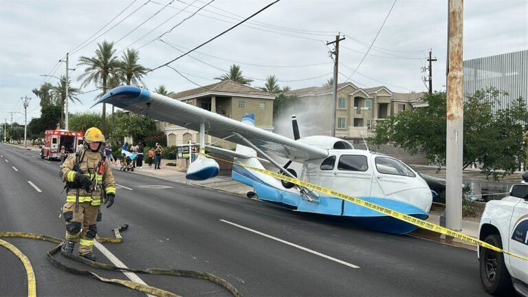 Phoenix, United States: A small aircraft was forced to make an emergency landing on a busy roadway in Phoenix, Arizona, on April 12, 2026, injuring three people onboard and triggering an investigation by federal aviation authorities. The incident occurred at approximately 2:37 p.m. local time near the intersection of 7th Street and Missouri Avenue, a densely trafficked corridor in the city. The single-engine aircraft descended into the urban area and ultimately landed on the roadway, narrowly avoiding vehicles, pedestrians, and surrounding infrastructure. Officials noted that the pilot’s handling of the emergency likely prevented a far more serious crash, as the aircraft did not collide with any cars or buildings despite the challenging environment. Witness accounts and initial reports indicate the aircraft came down in close proximity to active traffic lanes, reflecting the risk posed by the situation. Emergency services responded promptly to the scene. Authorities confirmed that three individuals onboard the aircraft sustained minor injuries, consistent across multiple reports. All occupants were able to exit the aircraft without assistance before first responders arrived. They were treated at the scene, and none required transportation to a hospital. The aircraft was identified as a Republic RC-3. During the emergency descent, the pilot reportedly attempted to avoid overhead power lines while identifying a viable landing zone. The aircraft is also believed to have struck a water main upon landing, resulting in localized disruption, including water leakage and additional hazards for emergency crews managing the scene. Following the incident, authorities shut down portions of the roadway to allow for emergency response, aircraft recovery, and preliminary investigative work. Traffic in the area was significantly impacted for several hours as crews secured the site and assessed potential infrastructure damage. No injuries were reported among individuals on the ground, a factor officials highlighted as notable given the location and timing of the emergency landing. The Federal Aviation Administration (FAA) and the National Transportation Safety Board (NTSB) have initiated an investigation into the incident. Authorities have not yet determined the cause of the emergency, and further details are expected as the investigation progresses.