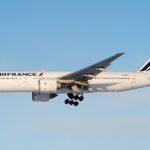 Munich, Germany: An Air France Boeing 777 operating a long-haul flight from Shanghai to Paris made an emergency landing at Munich Airport on May 7, 2026 after the crew reported an engine-related technical issue while cruising over Germany. The aircraft, operating as Flight AF111 between Shanghai Pudong International Airport and Paris Charles de Gaulle Airport, reportedly encountered a malfunction involving one of its General Electric GE90 engines during the latter stages of the ultra-long-haul journey. Flight tracking data showed the aircraft descending from cruise altitude after the crew transmitted the emergency squawk code 7700 to air traffic control. The Boeing 777-200ER diverted toward Munich while flying over southern Germany. The diversion occurred with roughly one hour remaining before the scheduled arrival in Paris, indicating the crew chose Munich as the nearest suitable airport capable of handling a widebody aircraft emergency involving a long-haul twin-engine jet. Emergency services were positioned alongside the runway as a precaution before the aircraft landed safely in Munich during the early morning hours. No injuries were reported among passengers or crew, and no emergency evacuation was required after landing. Airport rescue and firefighting teams reportedly inspected the aircraft following its arrival. Initial reports indicated the crew detected abnormal engine indications during cruise. The aircraft descended rapidly from high altitude before stabilizing for the diversion into Munich. The aircraft involved in the incident is understood to be an older Boeing 777-200ER airframe that remained on the ground in Munich for technical inspections following the precautionary landing. Air France later arranged onward travel and rebooking assistance for affected passengers traveling to Paris. Neither Air France nor airport authorities initially disclosed the exact nature of the engine malfunction.
