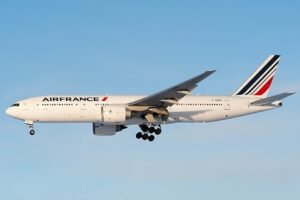 Munich, Germany: An Air France Boeing 777 operating a long-haul flight from Shanghai to Paris made an emergency landing at Munich Airport on May 7, 2026 after the crew reported an engine-related technical issue while cruising over Germany. The aircraft, operating as Flight AF111 between Shanghai Pudong International Airport and Paris Charles de Gaulle Airport, reportedly encountered a malfunction involving one of its General Electric GE90 engines during the latter stages of the ultra-long-haul journey. Flight tracking data showed the aircraft descending from cruise altitude after the crew transmitted the emergency squawk code 7700 to air traffic control. The Boeing 777-200ER diverted toward Munich while flying over southern Germany. The diversion occurred with roughly one hour remaining before the scheduled arrival in Paris, indicating the crew chose Munich as the nearest suitable airport capable of handling a widebody aircraft emergency involving a long-haul twin-engine jet. Emergency services were positioned alongside the runway as a precaution before the aircraft landed safely in Munich during the early morning hours. No injuries were reported among passengers or crew, and no emergency evacuation was required after landing. Airport rescue and firefighting teams reportedly inspected the aircraft following its arrival. Initial reports indicated the crew detected abnormal engine indications during cruise. The aircraft descended rapidly from high altitude before stabilizing for the diversion into Munich. The aircraft involved in the incident is understood to be an older Boeing 777-200ER airframe that remained on the ground in Munich for technical inspections following the precautionary landing. Air France later arranged onward travel and rebooking assistance for affected passengers traveling to Paris. Neither Air France nor airport authorities initially disclosed the exact nature of the engine malfunction.