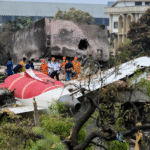 New Delhi, India: Indian investigators are preparing an interim report into last year’s fatal Air India Boeing 787 Dreamliner crash instead of a final report, as authorities continue examining one of the deadliest aviation disasters. According to Reuters, the Aircraft Accident Investigation Bureau (AAIB) is expected to issue the interim findings ahead of the first anniversary of the June 12, 2025 crash involving Air India Flight AI171, which was operating from Ahmedabad to London Gatwick. The accident killed 260 people after the Boeing 787-8 lost thrust moments after takeoff and crashed into a medical college hostel near the airport. The interim document will be “more comprehensive” than the 15-page preliminary report released in July 2025 and is expected to examine possible primary causes and contributing factors behind the crash. However, investigators said the final report is still not ready because of the complexity of the inquiry and the time required for additional analysis. The preliminary AAIB report found that the aircraft’s engine fuel control switches moved almost simultaneously from the “RUN” to “CUTOFF” position shortly after takeoff, starving both engines of fuel. Cockpit recordings reviewed during the investigation indicated confusion between the pilots over the movement of the switches. The early assessment by U.S. officials reviewing cockpit voice recordings supported the view that the captain may have cut fuel flow to the engines. Indian investigators, however, said at the time that it was “too early to reach any definite conclusions.” The ongoing investigation involves multiple international agencies because the aircraft was designed and manufactured in the United States. The U.S. National Transportation Safety Board (NTSB) is participating in the probe, while Boeing is assisting as a technical adviser. By issuing an interim report instead of a final one, Indian authorities will not be required to circulate draft findings in advance to the NTSB for review and comment. Under International Civil Aviation Organization (ICAO) rules, draft final reports are generally shared with participating states for consultation before publication. The investigation has gained renewed attention following a separate Air India Boeing 787 incident earlier this year involving fuel control switches. In February 2026, pilots operating a Dreamliner flight from London to Bengaluru reported that the fuel switches did not remain fixed in the “RUN” position during engine start attempts before stabilizing on a third attempt. Indian aviation regulator Directorate General of Civil Aviation (DGCA) officials are expected to travel to Boeing facilities in Seattle in June to observe testing of the fuel switch panel from that aircraft. Under international aviation standards, a final accident report is generally expected within one year of a crash. If the investigation remains incomplete, authorities are required to issue an interim statement outlining progress in the inquiry. Investigators said work on the final report is continuing and no timeline has been confirmed for its release.
