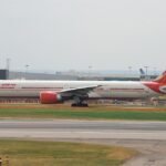 Delhi, India: An Air India Boeing 777-300ER operating flight AI173 from Delhi to San Francisco was forced to return to Delhi after suffering a technical malfunction mid-flight, remaining airborne for more than eight hours before landing safely at Indira Gandhi International Airport. The incident occurred on May 27 and involved approximately 230 passengers onboard the long-haul flight bound for the United States. According to airline officials and flight-tracking data, the aircraft had already spent over three hours in the air and entered Chinese airspace when the crew decided to discontinue the journey and return to Delhi in accordance with safety procedures. Initial reports stated that the issue involved the aircraft’s Traffic Collision Avoidance System (TCAS), a critical airborne safety system designed to prevent mid-air collisions by enabling aircraft to electronically detect and communicate with nearby traffic. The system operates independently of ground-based air traffic control and is considered mandatory for certain long-haul international operations, including trans-Pacific and North Atlantic routes. While Air India did not officially disclose the exact nature of the malfunction in its initial public statement, it is suspected that the aircraft experienced problems linked to the TCAS equipment during the flight. Some aviation reports and social media aviation monitoring pages further claimed that both TCAS channels onboard the aircraft became unavailable, though the airline has not publicly confirmed those specific details. Flight-tracking platforms showed the Boeing 777-300ER reversing course while over Chinese airspace before commencing the lengthy return sector to Delhi. Due to the aircraft’s weight, fuel load, and operational requirements for a safe landing, the jet remained airborne for several additional hours before touchdown. Air India confirmed that the aircraft landed safely and would undergo a detailed technical inspection in line with the carrier’s maintenance and safety protocols. The airline also stated that alternative arrangements were made for affected passengers, including hotel accommodation, refreshments, rebooking support, and rescheduling options. “The aircraft landed safely and will undergo technical inspection in line with Air India’s safety standards,” the airline said in its statement while expressing regret over the inconvenience caused to passengers. No injuries were reported during the incident, and passengers were safely deboarded after the aircraft’s arrival back in Delhi.
