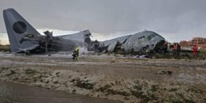 El Alto, Bolivia: Bolivian authorities have arrested the pilot and co-pilot of a Bolivian Air Force Lockheed C-130H Hercules following an official investigation that concluded the February 2026 crash near La Paz was preventable and largely linked to operational errors during landing. The aircraft crashed on February 27, 2026, while attempting to land at El Alto International Airport, after completing a domestic flight from Santa Cruz. During landing in adverse weather, the aircraft failed to decelerate on the runway, veered off the surface, breached the airport perimeter, and ploughed into a busy roadway, striking multiple vehicles before breaking apart in a densely populated area. The crash resulted in 24 fatalities and at least 43 injuries, with the majority of victims on the ground. Among the dead were civilians, including passengers in public transport vehicles hit by the aircraft. Several crew members were also injured, making it one of Bolivia’s deadliest aviation disasters in recent decades. Initial reports had indicated a lower death toll, but the number rose significantly as rescue teams recovered victims from the wreckage and surrounding impact zone. The situation on the ground quickly descended into chaos after it emerged that the aircraft was transporting a large consignment of newly printed banknotes for the Central Bank of Bolivia. The impact scattered currency across the crash site, drawing crowds of civilians who rushed to collect the money. Authorities deployed police and military units, including the use of tear gas, to secure the area and allow emergency responders to operate. Officials later declared the banknotes invalid, as they had not yet entered circulation, and subsequently destroyed recovered cash. A formal investigation by the Bolivian Air Force, the findings of which were released on April 30, 2026, identified a chain of operational failures rather than a single-point cause. Investigators determined that adverse weather conditions, including a wet runway and reduced braking efficiency, were contributing factors but not the primary cause. Instead, the report placed significant emphasis on pilot handling during the landing phase. According to the findings, the aircraft executed an improper landing sequence, touching down with the nose gear before the main landing gear, a critical procedural error that compromised braking effectiveness and aircraft stability. This technique reduced aerodynamic drag and delayed the full deployment of braking systems, significantly increasing stopping distance on an already wet runway. The report further highlighted inadequate coordination and communication with air traffic control, which may have affected situational awareness during the final approach and landing rollout. Investigators also pointed to failure to execute a go-around despite unstable landing conditions, a decision that could have prevented the accident altogether. Additionally, the probe noted that standard landing protocols and safety margins were not maintained, particularly given the weather conditions. The combination of these factors resulted in a runway excursion at high speed, leaving the crew unable to regain control before the aircraft exited the airfield boundary. Crucially, investigators concluded that the crash was preventable, stating that proper adherence to established landing procedures and timely decision-making would likely have avoided the accident. Based on these findings, Bolivian prosecutors issued arrest warrants for the pilot and co-pilot on April 30, with both taken into custody on May 1, 2026, following questioning. The two are currently being held in pre-trial detention and face charges of involuntary manslaughter, with authorities alleging that negligent handling of the aircraft and failure to follow standard operating procedures directly contributed to the loss of life.