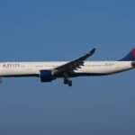 Delta Flight Makes Emergency Landing In Paris After Engine Flames And Cabin Power Loss SEO DES: Passengers heard an explosion-like sound from the left engine, saw sparks and flashes, while cabin lights briefly went dark mid-flight SOCIAL: A Delta Air Lines Airbus A330-300 flying from New York to Milan made an emergency landing in Paris after passengers heard a loud bang from the engine, saw flashes or flames outside the aircraft, and experienced a brief cabin power loss. The crew declared an emergency over France and diverted safely to Charles de Gaulle Airport, where fire and rescue teams were waiting. No injuries were reported, and the aircraft was later grounded for technical inspection following the suspected engine-related malfunction. Paris, France: A Delta Air Lines Airbus A330-300 operating a transatlantic service from New York to Milan made an emergency landing in Paris after passengers reported hearing a loud bang from one of the aircraft’s engines, followed by visible flames outside the cabin and a temporary loss of electrical power. The incident involved Delta Flight DL286, which departed John F. Kennedy International Airport on the afternoon of May 18 for a scheduled overnight flight to Milan Malpensa Airport aboard an 18-year-old Airbus A330-300. The aircraft had crossed the Atlantic normally and was cruising over French airspace early on May 19 when passengers and crew experienced what was described as a sudden “explosion-like” sound from the left engine area. Several passengers later said they observed sparks or flashes from the engine, while others reported the cabin briefly went dark as electrical power fluctuated onboard. Flight tracking data showed the aircraft abruptly altered course and declared an emergency using squawk code 7700 before diverting toward Charles de Gaulle Airport. Emergency vehicles, including airport fire and rescue crews, were positioned alongside the runway as the widebody jet approached Paris. The Airbus landed safely at CDG without further incident. No injuries among passengers or crew were immediately reported. Passengers onboard later described a tense but controlled atmosphere inside the cabin. One traveler wrote online that “the lights went out and the flight attendants booked it to the front of the plane,” while another passenger claimed people seated on the left side of the aircraft could see what appeared to be an engine fire. Others praised the crew for remaining calm and reassuring passengers throughout the diversion and landing. The aircraft involved in the incident was identified as a Delta Airbus A330-323 registered N818NW. The jet had departed JFK at approximately 4:28 PM EDT and diverted into Paris roughly six hours later after the crew declared the emergency over France. While the exact technical cause has not yet been officially confirmed, early reports indicate the crew responded to an engine-related malfunction accompanied by an electrical disturbance affecting cabin systems. Following the landing, the aircraft was removed from service for inspection by maintenance personnel and aviation authorities. Delta Air Lines had not released a detailed technical statement at the time of publication.