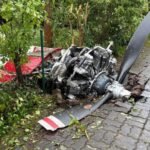 Limburgerhof, Germany: Two people were killed after a small aircraft crashed into a residential neighborhood in the German municipality of Limburgerhof in Rhineland-Palatinate on May 16, authorities and local media confirmed. The crash occurred at around 11:30 a.m. local time near Max-Planck-Straße on the outskirts of Limburgerhof, a town south of Mannheim with a population of about 11,600 residents. Police said the aircraft went down on a residential property, scattering debris across houses, garages, gardens, pathways and nearby streets over a wide area. According to police spokesperson Thorsten Mischler, both occupants of the aircraft died in the crash. Authorities later confirmed the victims were male. Initial police statements said there were no confirmed injuries among residents on the ground, although German outlet Welt reported that a 66-year-old woman was slightly injured after falling while trying to escape from falling debris. Witnesses described hearing a loud bang or explosion moments before the aircraft came down. Several eyewitnesses told investigators the plane appeared to explode in mid-air before crashing into the residential area. Reports also stated the aircraft may have clipped or grazed a house during its descent. Parts of the wreckage became lodged in fences while other debris landed in front of homes and across surrounding properties. The main section of the aircraft reportedly came to rest in the garden of a residential house. Police and emergency responders launched a major operation immediately after the crash. Authorities established a large security perimeter around the site while investigators documented debris locations and examined the wreckage. A police helicopter was deployed shortly after noon to capture aerial photographs of the accident scene as part of the investigation. Investigators said the aircraft had departed earlier in the day from Aachen in western Germany. However, officials stated that both the planned route and intended destination of the flight remain under investigation. The exact cause of the crash has not yet been determined. Authorities also appealed to residents and property owners in the area to report any additional debris or footage connected to the incident. Police requested that discovered wreckage pieces be left untouched until they could be officially documented and collected by investigators. A temporary support and information center for affected residents and witnesses was established at the Albert-Schweitzer-Haus in Limburgerhof.