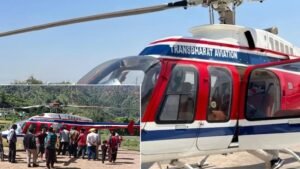 Tehri Garhwal, India: A potential tragedy was averted in Uttarakhand on Wednesday, May 20, 2026, after a helicopter carrying Char Dham pilgrims from Badrinath to Dehradun made an emergency landing in Tehri Garhwal district following a mid-air technical problem and contact with a high-tension power line. The Bell 407 helicopter, operated by Trans Bharat Aviation, was carrying seven people, including the pilot. Officials confirmed that all passengers survived without injuries. According to officials from the Uttarakhand administration and disaster management authorities, the incident occurred between approximately 8:30 am and 9:30 am while the helicopter was flying over the Chamba–Arakot sector in Tehri district. The aircraft had departed from Badrinath Dham and was en route to Dehradun. Authorities said the helicopter encountered severe downdraft conditions and sudden localized weather turbulence in the valley region. During the emergency maneuver, the rear section of the aircraft reportedly struck a high-tension electricity transmission line before the pilot managed to bring the helicopter down safely in agricultural fields near the Satyo–Saklana and Nawagaon area of Tehri Garhwal district. The District Magistrate of Tehri, Nikita Khandelwal, said that the helicopter made the landing after encountering sudden localised weather turbulence.“While landing, the rear end collided with the power line. However, the tourists have been sent to Dehradun while the helicopter flew back for maintenance,” she added. The power line of a 33 KV line high-tension wire. Officials confirmed that the helicopter’s tail or rear section sustained damage in the collision. The helicopter was being piloted by Captain Anupam Chaudhary, an experienced former Indian Air Force pilot from Meerut. Officials and local authorities credited the pilot’s quick decision-making and calm handling of the situation for preventing a catastrophic crash in the mountainous terrain. Passengers were devotees from a single family based in Delhi’s Punjabi Bagh area. Passengers were identified as Son Raj Suri, Shriraj Suri, Bhumi Suri, Parth Suri, Himanshi Patel, and Nishka. Immediately after the emergency landing, teams from local police, district administration, SDRF-linked authorities, and disaster management officials rushed to the site and initiated rescue and safety operations. The passengers were later transported safely to Dehradun by road taxi services. Officials confirmed that a detailed technical and aviation investigation has been launched into the incident. The Uttarakhand Civil Aviation Development Authority said standard regulatory inspections and technical examinations are being conducted in coordination with aviation authorities and the helicopter operator. Last Year on June 15, 2025, an Aryan Aviation helicopter flying from Kedarnath to Guptkashi crashed near Gaurikund in Rudraprayag district, killing all seven people onboard, including the pilot and a 23-month-old child. Preliminary reports linked the crash to poor weather, low visibility, and difficult flying conditions in the Himalayan region. Following the tragedy, Uttarakhand authorities temporarily suspended Char Dham helicopter operations and ordered stricter safety reviews.