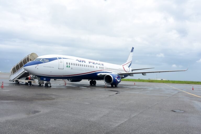 Abuja, Nigeria: Nigeria’s domestic aviation sector has entered a fresh regulatory dispute after the Nigerian Civil Aviation Authority (NCAA) placed 11 airlines on a “No-Pay-No-Service” list over alleged unpaid statutory obligations, prompting strong denials from airline operators and raising concerns over potential operational disruptions across the country. The directive, contained in an internal NCAA memo dated May 22, 2026, instructed all directorates and regional offices of the regulator not to provide services to affected airlines without clearance from the Directorate of Finance and Accounts. The memo was signed by Olufemi Odukoya, NCAA’s Director of Finance and Accounts, and copied to the Director-General of Civil Aviation (DGCA), Capt. Chris Najomo, along with senior officials within the authority. The airlines named in the updated “No-Pay-No-Service” list are: Air Peace Ibom Air Arik Air United Nigeria Airlines Umza Air NG Eagle Max Air Caverton Helicopters Overland Airways Rano Air ValueJet According to the memo, “no directorate should render any service to the above airlines without financial clearance from the Director of Finance and Accounts.” The NCAA argued that the move was necessary because airlines had failed to meet outstanding financial obligations owed to the regulator. At the center of the dispute are the statutory five percent Ticket Sales Charge (TSC) and Cargo Sales Charge (CSC), levies collected by airlines on behalf of the NCAA from passengers and cargo operators. The regulator relies heavily on these remittances to fund safety oversight, inspections, personnel obligations, economic regulation and other administrative responsibilities within Nigeria’s aviation sector. However, the Airline Operators of Nigeria (AON), representing domestic carriers, rejected the allegations and described reports suggesting airlines were indebted to the NCAA as inaccurate. According to the operators, many NCAA services are already paid for in advance under a “cash-before-service” arrangement, making the regulator’s characterization misleading. The airlines reportedly argued that the disputed amounts relate mainly to the Ticket Sales Charge collection system rather than direct service debts. Industry operators also renewed calls for reforms to Nigeria’s aviation charging structure, urging the government to amend regulations so the NCAA can collect the five percent TSC directly from passengers instead of routing collections through airlines. Carriers argue that the current system exposes them to banking charges, reconciliation complications and financial pressure amid rising operational costs. The latest dispute comes during a difficult financial period for Nigerian airlines, which continue to face mounting economic challenges driven by soaring Jet A1 fuel prices, foreign exchange shortages, high maintenance expenses, airport charges and weak profit margins. In April 2026, domestic carriers had warned of possible operational shutdowns due to escalating fuel costs and debt burdens. Following negotiations with airline operators, Nigerian President Bola Tinubu approved, in principle, a 30 percent reduction or write-off of debts owed by airlines to aviation agencies as part of broader relief measures aimed at stabilizing the sector. The ICIR reported that Tinubu approved the debt relief initiative on April 23, 2026, though implementation had not commenced as of late May. Explaining the delay, NCAA Director-General Capt. Chris Najomo stated that the process required consultations with airlines and aviation agencies before execution. Another aviation consultant, Adeola Fadairo, defended the NCAA’s action, arguing that the Ticket Sales Charge belongs to the regulator and should not be retained by airlines to offset operational shortfalls. He described non-remittance of statutory levies as a serious breach of public trust and corporate responsibility. Meanwhile, United Nigeria Airlines confirmed it had opened discussions with the NCAA regarding the matter, while several other affected airlines had not publicly commented at the time of reporting. However, the NCAA later suspended enforcement of the “No-Pay-No-Service” directive following industry backlash and concerns that the move could disrupt airline operations, licensing processes and other regulatory services. The regulator said the temporary relief would allow further consultations with airlines and aviation stakeholders over the disputed Ticket Sales Charges and outstanding obligations.