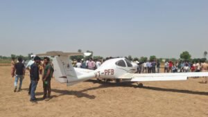 Aligarh, India: A training aircraft belonging to a private flying club made an emergency landing in an agricultural field in Uttar Pradesh’s Aligarh district on Sunday after suffering a technical malfunction during a routine training sortie, with both occupants escaping safely, according to the officials and PTI . The aircraft involved in the incident was identified as a Diamond DA-40, a single-engine, four-seater trainer aircraft bearing registration VT-PFB, which was operating from Dhanipur Airport in Aligarh when the crew reported a mid-air technical snag prompting the pilots to carry out a precautionary landing in a field near Changeyri (also reported as Changari) village under the Harduaganj police station area. Officials said the aircraft belonged to the Pioneer Flying Club, one of the pilot training organisations operating from Dhanipur Airport. The incident occurred during a scheduled training exercise on Sunday morning, with reports placing the emergency landing between approximately 9:30 am and 11 am. The instructor pilot and trainee pilot safely exited the aircraft after the landing and did not suffer injuries. Both were later taken to a district hospital for routine medical examination. Eyewitnesses said panic spread among villagers after they saw the aircraft descending suddenly towards the ground. However, the plane landed safely in the field without causing any damage or injuries. Following the incident, local police, fire brigade personnel and district administration officials rushed to the spot. City Magistrate Atul Gupta and Airport Director Satyavrat also inspected the site. Authorities said the pilots managed to bring the aircraft down safely in the agricultural field without causing casualties or significant structural damage to the aircraft. The successful emergency handling prevented what officials described as a potentially serious accident. City Magistrate Atul Gupta confirmed that airport authorities were informed shortly after the incident and emergency response teams were dispatched to the site. Officials from the Airports Authority of India (AAI) subsequently initiated a probe into the technical malfunction and circumstances leading to the forced landing. Last year, a trainee pilot from Pioneer Flying Club crashed a solo-operated Diamond DA-40 trainer aircraft at Aligarh’s Dhanipur Airstrip after the aircraft reportedly skidded off the runway during landing and slammed into the airport boundary wall. The May 2025 incident occurred during a routine solo training sortie, with trainee pilot escaping unhurt despite the aircraft sustaining heavy damage to its nose and front landing gear. Also, in January 2022, a Cessna 172 aircraft from the same academy made an emergency landing in an agricultural field near Dhanipur airstrip during a night cross-country training session. Both the instructor and trainee pilot survived with minor injuries.