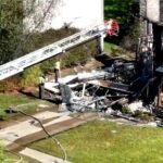 Ohio, United States: Two people were killed after a small single-engine aircraft crashed into a residential home in Akron, Ohio, on Thursday afternoon, triggering a massive fire and prompting a federal investigation into the cause of the accident. Authorities confirmed that the victims were the two occupants onboard the aircraft, while a family of four inside the house escaped safely without injuries. According to the Federal Aviation Administration (FAA), the aircraft involved was a Piper PA-28 Cherokee, identified in several reports as a 1963 Piper Cherokee. The aircraft crashed into a home on Canterbury Circle at approximately 3:45 p.m. local time after departing from Akron Fulton Regional Airport, located only a few miles from the crash site. The identities of the two deceased occupants had not been officially released as of the latest updates. Authorities also have not disclosed whether the flight was private, instructional, or recreational. The Akron Fire Department said a couple and their two children were inside the residence when the aircraft slammed into the garage area of the house. All four managed to escape unharmed before flames engulfed parts of the structure. Akron Fire Department District Chief Sierjie Lash confirmed during a press briefing that no one on the ground suffered injuries. “There were a couple and two children that lived there. They were all four home, and they were able to get out with no injuries, so we're very fortunate that they are safe,” Lash said. Emergency responders initially treated the incident as a residential structure fire after receiving multiple calls reporting explosions, heavy smoke and flames. “We got a call that residents saw a plane going down into the house,” Lash said. “We got more calls that people heard explosions.” Residents in the neighborhood described hearing a loud whining sound moments before the impact. Neighbor Christi Gould said power briefly flickered before the crash. “We were sitting there, the power flickered for a few seconds, and then I heard the whining of a plane,” she said, adding that a loud explosion shook nearby homes seconds later. Another resident, Jewell Ulrich, described seeing the aircraft debris scattered between homes after the crash. “That fire was instant,” Ulrich said. “It was so hot.” Her husband, Steve Ulrich, said the aircraft’s tail section remained lodged near the garage area after the impact. Videos circulating on social media showed thick black smoke rising above the suburban neighborhood while flames consumed parts of the residence. The FAA and the National Transportation Safety Board (NTSB) have launched an investigation into the crash. The NTSB will lead the investigation and is expected to release a preliminary report in the coming days. As of now, officials have not confirmed the cause of the accident. No distress call, mechanical failure, weather issue or pilot-related factor has yet been officially identified. Authorities also evacuated at least one neighboring home as a precaution while investigators assessed structural damage to the impacted residence.