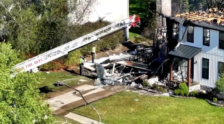Ohio, United States: Two people were killed after a small single-engine aircraft crashed into a residential home in Akron, Ohio, on Thursday afternoon, triggering a massive fire and prompting a federal investigation into the cause of the accident. Authorities confirmed that the victims were the two occupants onboard the aircraft, while a family of four inside the house escaped safely without injuries. According to the Federal Aviation Administration (FAA), the aircraft involved was a Piper PA-28 Cherokee, identified in several reports as a 1963 Piper Cherokee. The aircraft crashed into a home on Canterbury Circle at approximately 3:45 p.m. local time after departing from Akron Fulton Regional Airport, located only a few miles from the crash site. The identities of the two deceased occupants had not been officially released as of the latest updates. Authorities also have not disclosed whether the flight was private, instructional, or recreational. The Akron Fire Department said a couple and their two children were inside the residence when the aircraft slammed into the garage area of the house. All four managed to escape unharmed before flames engulfed parts of the structure. Akron Fire Department District Chief Sierjie Lash confirmed during a press briefing that no one on the ground suffered injuries. “There were a couple and two children that lived there. They were all four home, and they were able to get out with no injuries, so we're very fortunate that they are safe,” Lash said. Emergency responders initially treated the incident as a residential structure fire after receiving multiple calls reporting explosions, heavy smoke and flames. “We got a call that residents saw a plane going down into the house,” Lash said. “We got more calls that people heard explosions.” Residents in the neighborhood described hearing a loud whining sound moments before the impact. Neighbor Christi Gould said power briefly flickered before the crash. “We were sitting there, the power flickered for a few seconds, and then I heard the whining of a plane,” she said, adding that a loud explosion shook nearby homes seconds later. Another resident, Jewell Ulrich, described seeing the aircraft debris scattered between homes after the crash. “That fire was instant,” Ulrich said. “It was so hot.” Her husband, Steve Ulrich, said the aircraft’s tail section remained lodged near the garage area after the impact. Videos circulating on social media showed thick black smoke rising above the suburban neighborhood while flames consumed parts of the residence. The FAA and the National Transportation Safety Board (NTSB) have launched an investigation into the crash. The NTSB will lead the investigation and is expected to release a preliminary report in the coming days. As of now, officials have not confirmed the cause of the accident. No distress call, mechanical failure, weather issue or pilot-related factor has yet been officially identified. Authorities also evacuated at least one neighboring home as a precaution while investigators assessed structural damage to the impacted residence.