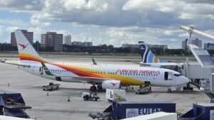 Amsterdam, Netherlands: A Surinam Airways flight from Amsterdam to Paramaribo suffered a landing gear door malfunction on May 8, creating significant aerodynamic drag and increased fuel burn that forced the aircraft to return to Amsterdam as a precaution. The flight was being operated by Universal Sky Carrier under a wet-lease arrangement using a former Lufthansa Airbus A340-600. After identifying the issue, the crew opted to discontinue the flight and initiated a precautionary return to Schiphol. The aircraft reportedly remained airborne for some time to manage fuel levels before safely landing back in Amsterdam without further incident. No injuries among passengers or crew were reported. Emergency services were positioned as a standard precaution during the aircraft’s return. The disruption resulted in a delay to the Amsterdam-Paramaribo service as the aircraft required technical inspection following landing. The mandatory crew rest requirements and maintenance checks led to the flight being rescheduled for departure on May 10. The incident comes as Surinam Airways continues relying on Airbus A340 aircraft for its long-haul Amsterdam operations amid ongoing fleet and operational challenges. The carrier has operated multiple leased A340 variants over recent years, including aircraft previously sourced from Air Belgium and other operators for the Paramaribo route. The airline has faced earlier operational disruptions involving Airbus A340 aircraft, including flap-related return incidents and temporary aircraft groundings on the Amsterdam sector. While no official technical statement has yet been released detailing the exact cause of the landing gear door malfunction, the aircraft landed safely and no damage or injuries were reported.
