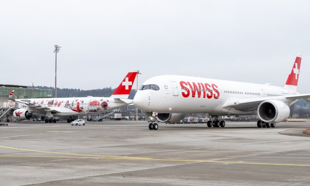 Almaty, Kazakhstan: A SWISS International Air Lines Airbus A350 operating flight LX123 from Seoul Incheon to Zurich made an emergency diversion to Almaty, Kazakhstan, on May 6 after the co-pilot suffered a medical emergency while the aircraft was cruising over Kazakhstan. According to the airline’s official statement, the incident occurred approximately six hours into the long-haul flight when the co-pilot became unwell during the journey. The Airbus A350-941, registered HB-IFB, was carrying 227 passengers and 14 crew members at the time. Flight tracking data showed the aircraft squawking transponder code 7700, the international emergency signal used to indicate a general emergency before diverting south toward Almaty International Airport. The aircraft landed safely shortly before 1 p.m. local time on May 6. SWISS confirmed that three doctors travelling onboard assisted the crew by providing immediate medical aid to the co-pilot during the diversion. Based on their recommendation, the operating crew decided to divert to Almaty to ensure the pilot received urgent medical attention as quickly as possible. Emergency medical teams were waiting when the aircraft arrived in Almaty. The co-pilot was subsequently transported to a local hospital accompanied by another crew member. Airport authorities reported that the pilot was taken to Almaty City Hospital No. 4 for further examination and treatment. Local reports also referenced a suspected acute abdominal condition, though SWISS has not officially confirmed the nature of the medical issue. Following the unscheduled landing, passengers and crew were accommodated overnight in hotels in Almaty while the airline arranged for an additional pilot to be flown in. SWISS stated that the flight could not continue immediately because aviation regulations require a specifically qualified first officer to occupy the co-pilot’s right-hand seat. The airline also noted that crew duty-time limitations would have been exceeded if the flight had continued without additional crew support. In its statement, the airline said the “health and wellbeing” of its colleague remained the top priority while acknowledging the disruption caused to passengers’ travel plans. The carrier added that teams were working to support affected travellers and coordinate the continuation of the journey to Zurich.